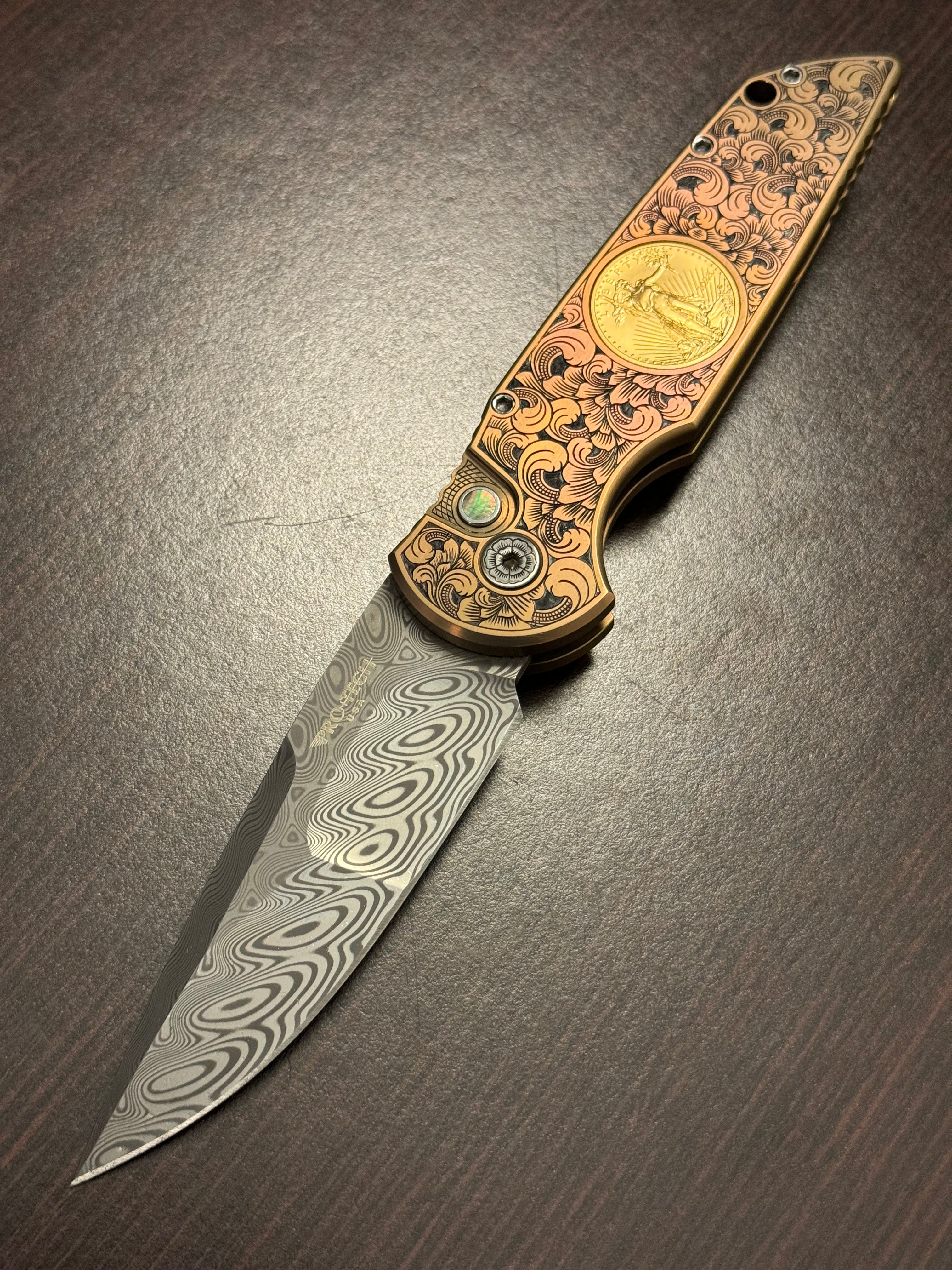 Protech Pro-Tech 2024 TR-3 Custom 002 Champagne Pink Ti Frame Bruce Shaw Hand Engraving with American Eagle Gold Coin, Irie Ground Damasteel Blade