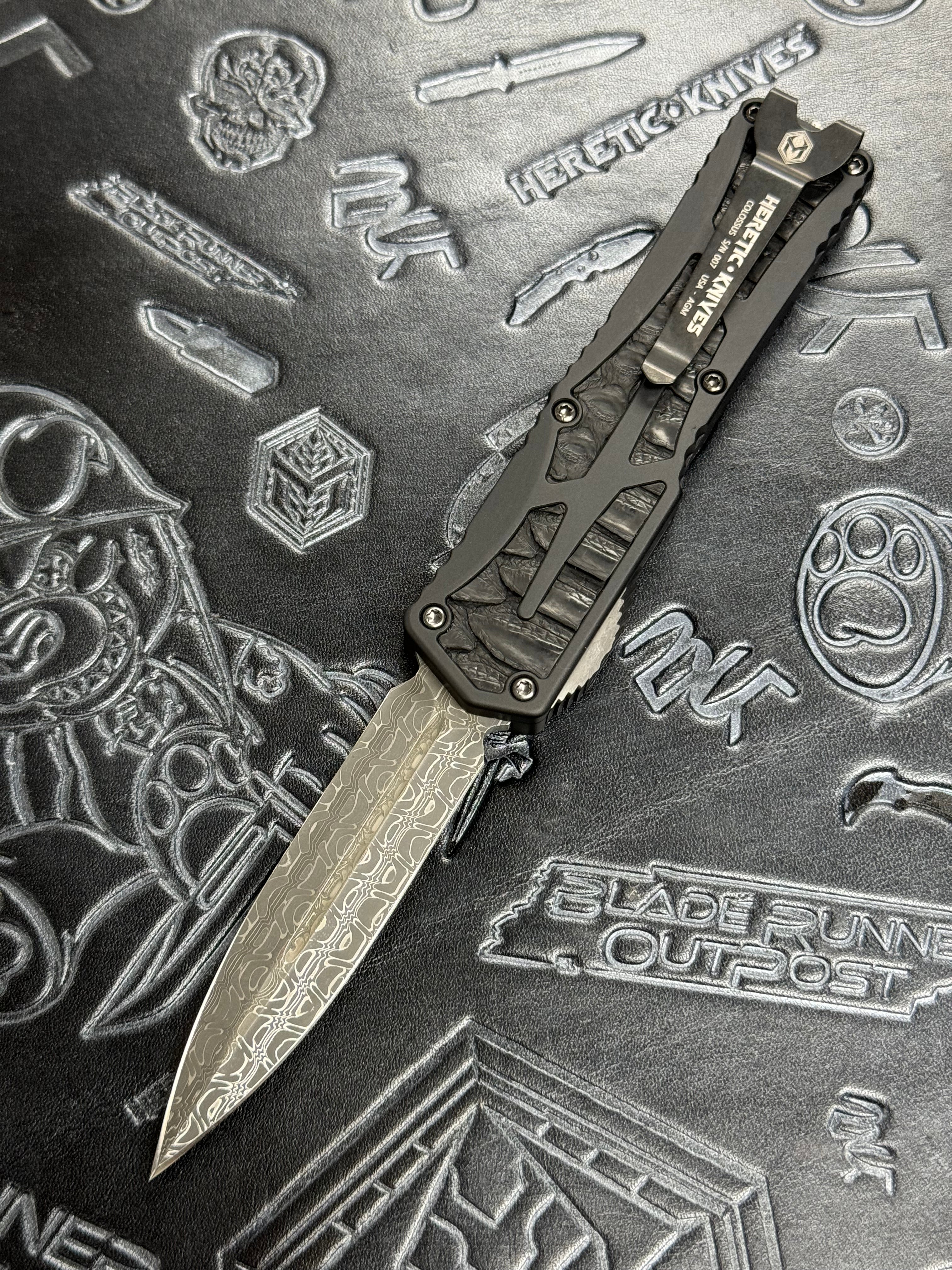 Pre Owned Heretic Knives Custom Colossus D/E Vegas Forged Reptilian Damascus, Anodized Aircraft Aluminum w/ Black Python Inlay