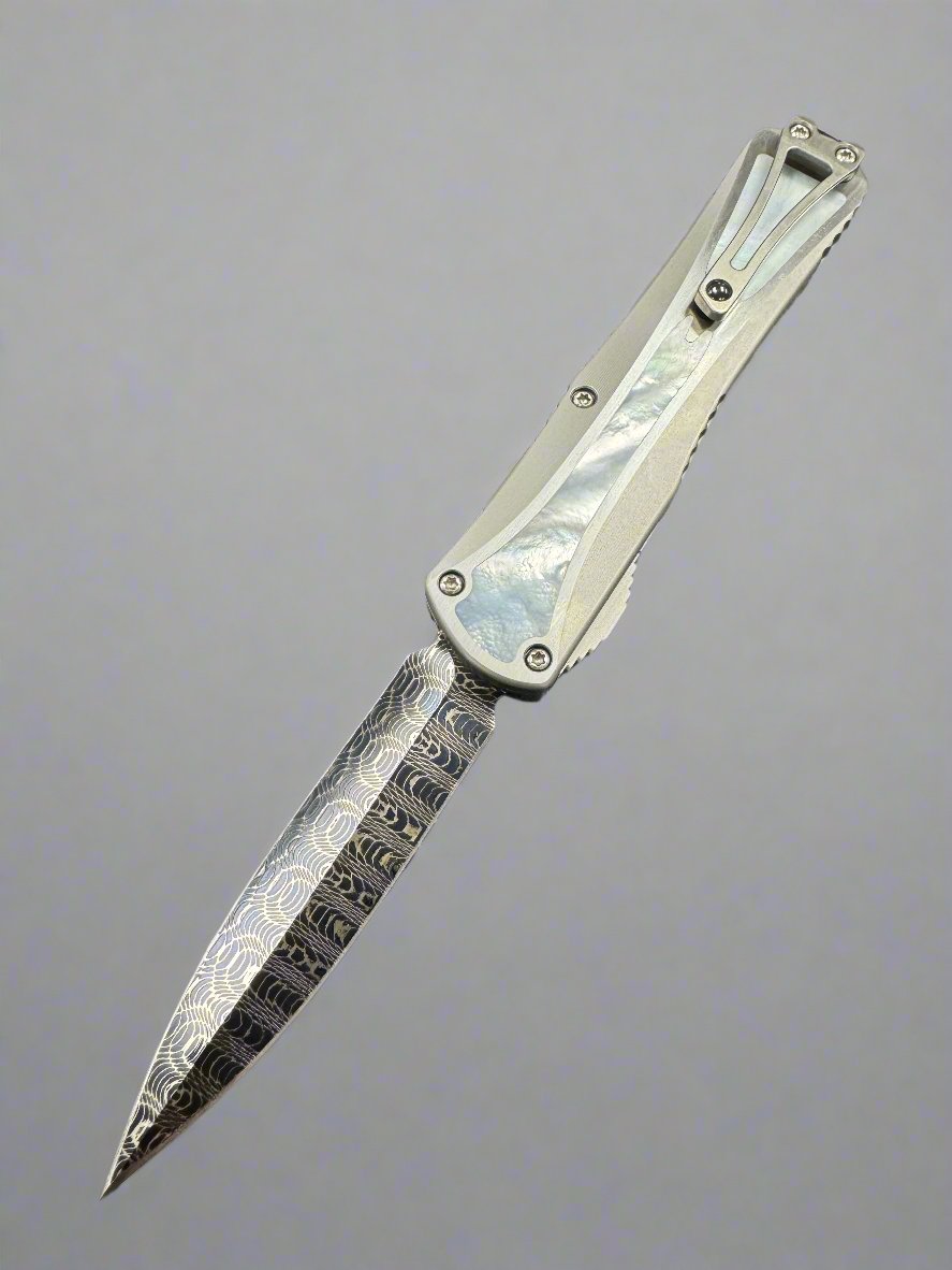 Pre Owned Heretic Knives Manticore X Hand Ground Vegas Forge Blued Damascus D/E & Hefted Stainless Steel Handle w/ Mother of Pearl Inlays