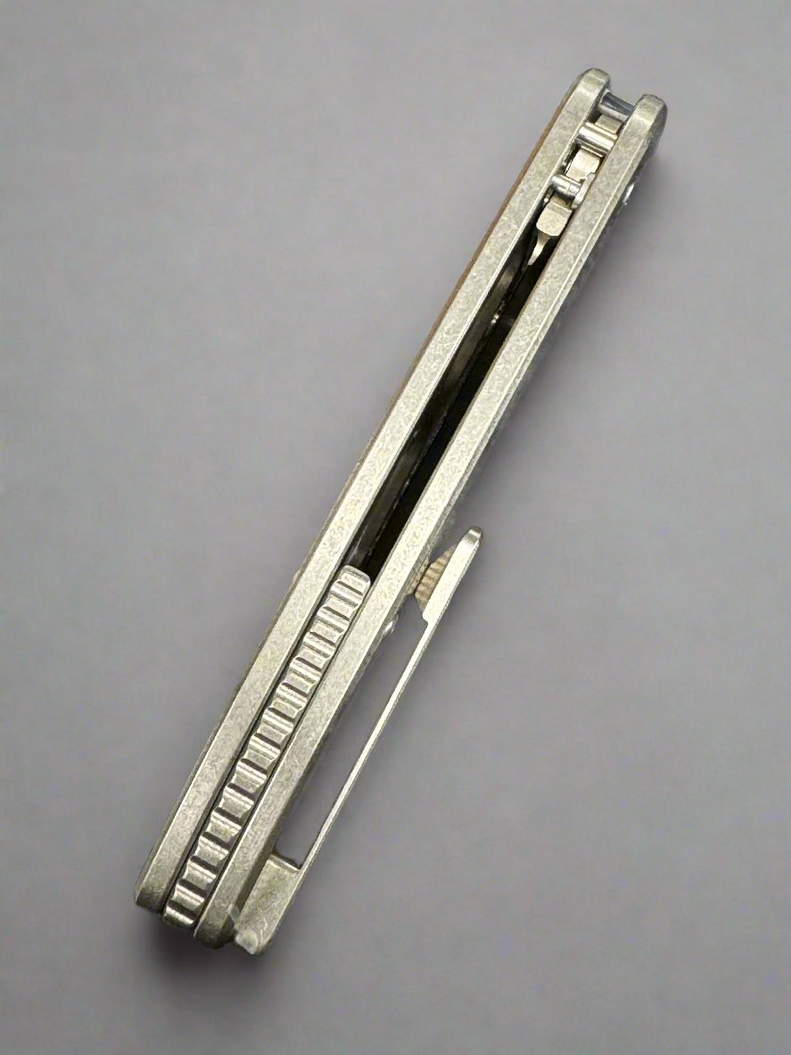 American Blade Works ABW MODEL 1 BUTTON LOCK TITANIUM Magnacut