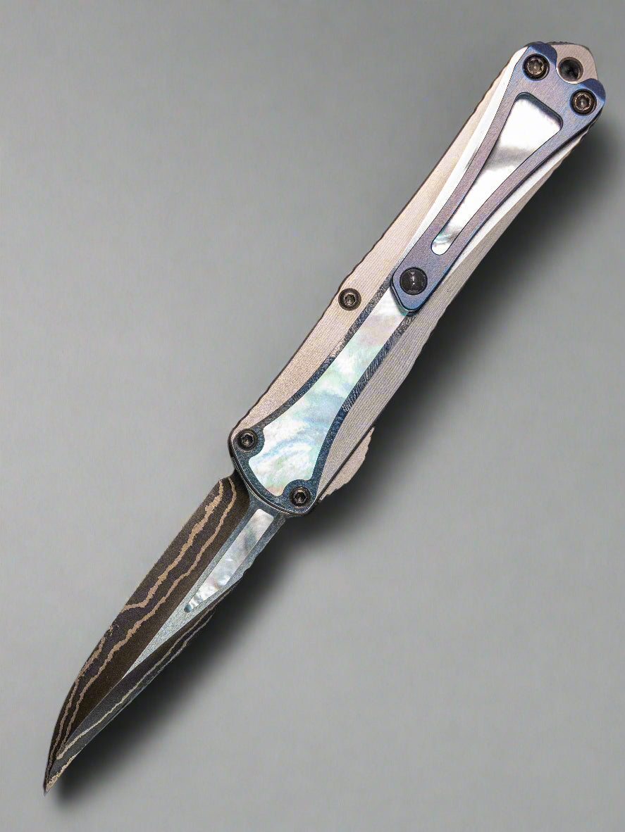 Heretic Manticore S Bowie Baker Forge Double Shim Stainless Steel Chassis Mother of Pearl Inlays Blue Ano Clip