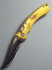 Marfione Custom Knives Amphibian RAM-LOK Metroid Sanmai w/ Nickel Shim Broken Anvil Damascus & Sovereign Gold Stippled Titanium w/ Joint Logo Dagger Engraved & Two Tone Bronzed Hardware