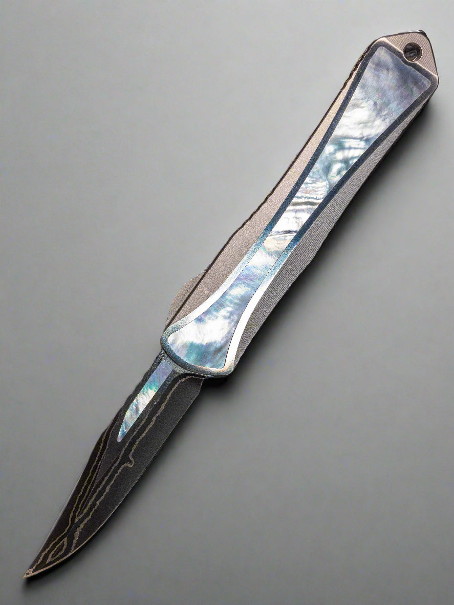 Heretic Manticore S Bowie Baker Forge Double Shim Stainless Steel Chassis Mother of Pearl Inlays Blue Ano Clip