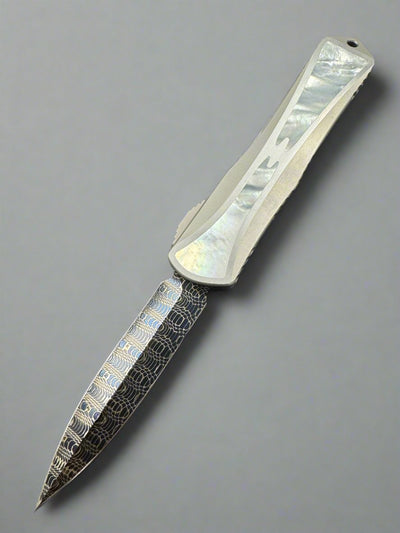 Pre Owned Heretic Knives Manticore X Hand Ground Vegas Forge Blued Damascus D/E & Hefted Stainless Steel Handle w/ Mother of Pearl Inlays