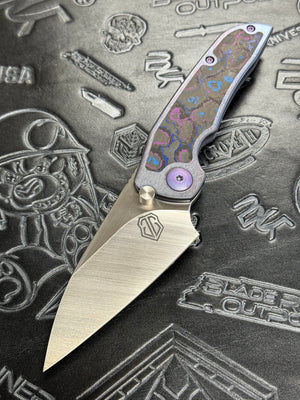 John Gray PHAT THUCK Satin Finish Magnacut Blade, Anodized Titanium Handles With Timascus Camo Carbon Inlay