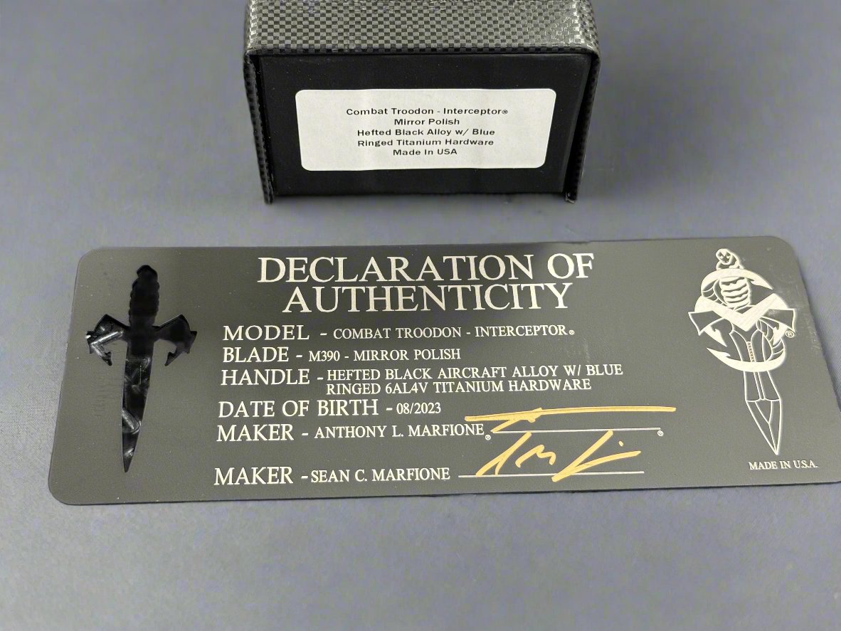 Pre Owned Marfione Custom Knives Combat Troodon Interceptor Mirror Polish w/ Hefted Black Handle & Blue Ringed Hardware