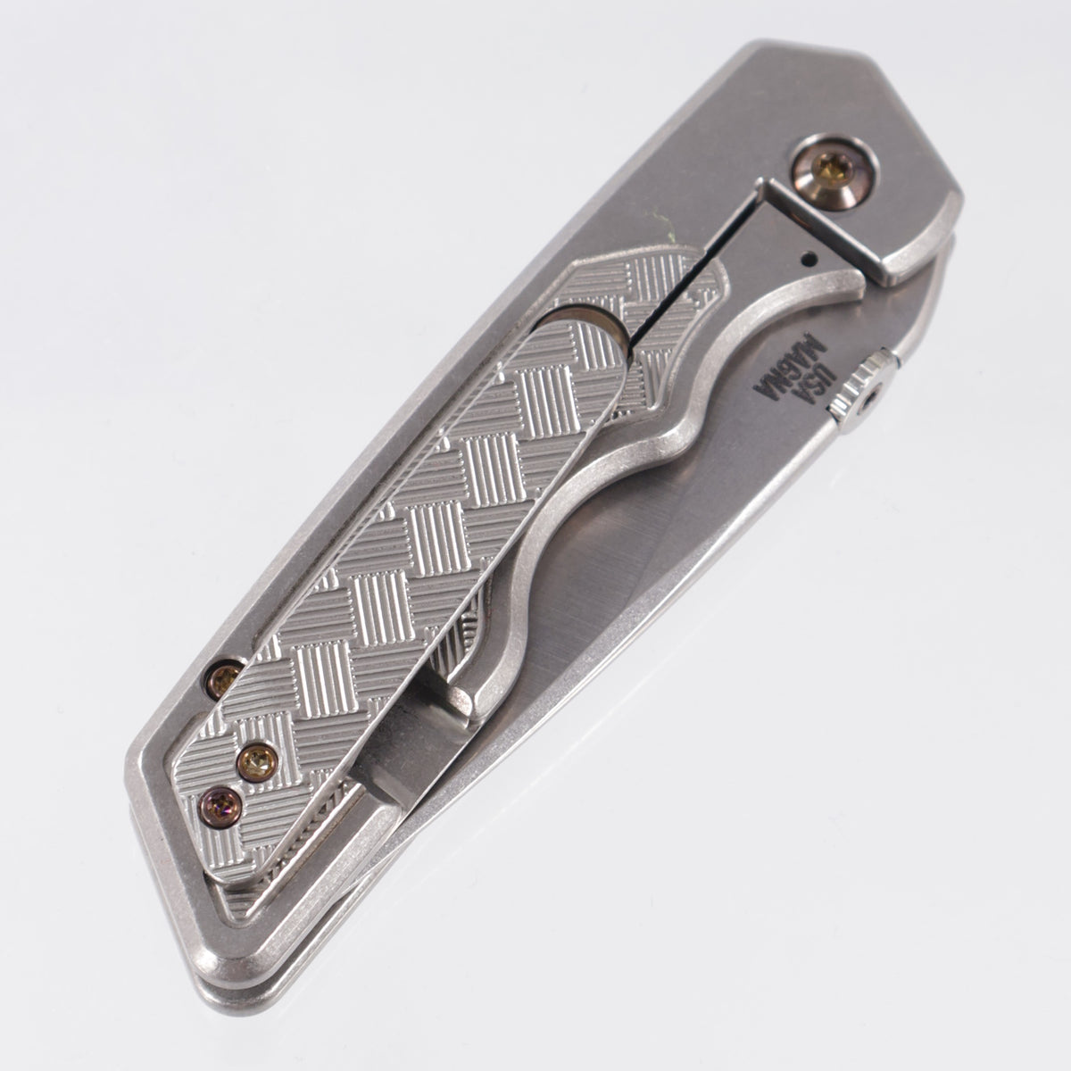 Attn2Detail Mercantile Mk.3 Medium Gen4 Drop Point Rising Grind - Bright Stonewash Titanium w/ Basketweave Faux Inlay Milling & Bronze Ano Hardware- Stonewash Satin Magnacut