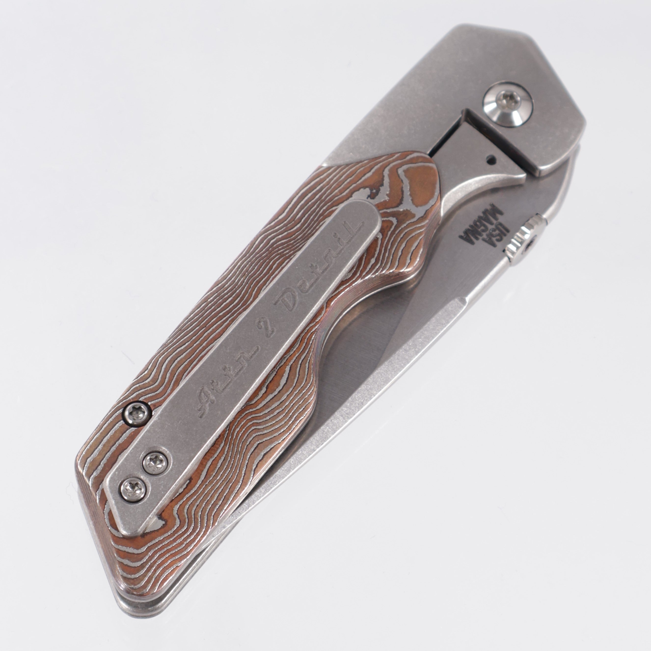 Attn2Detail Mercantile Mk.3 Medium Bolster Lock Gen4 Drop Point Rising Grind - Bright Stonewash Titanium w/ Zirc & Copper Damascus Scales - Stonewash Satin Magnacut