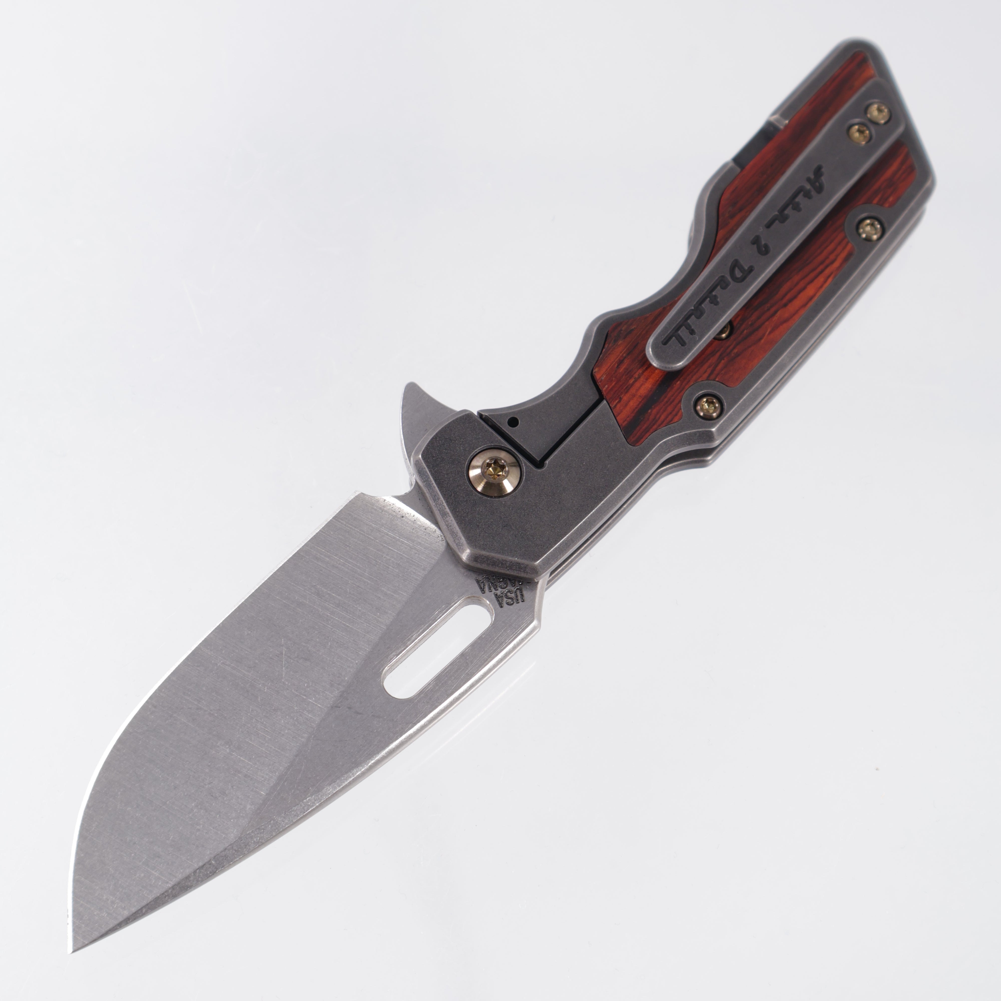 Attn2Detail Mercantile Mk.1 Medium Gen4 Drop Point Rising Grind - Blackened Titanium w/ Cocobolo Inlays & Gold Ano Hardware - Stonewash Satin Magnacut
