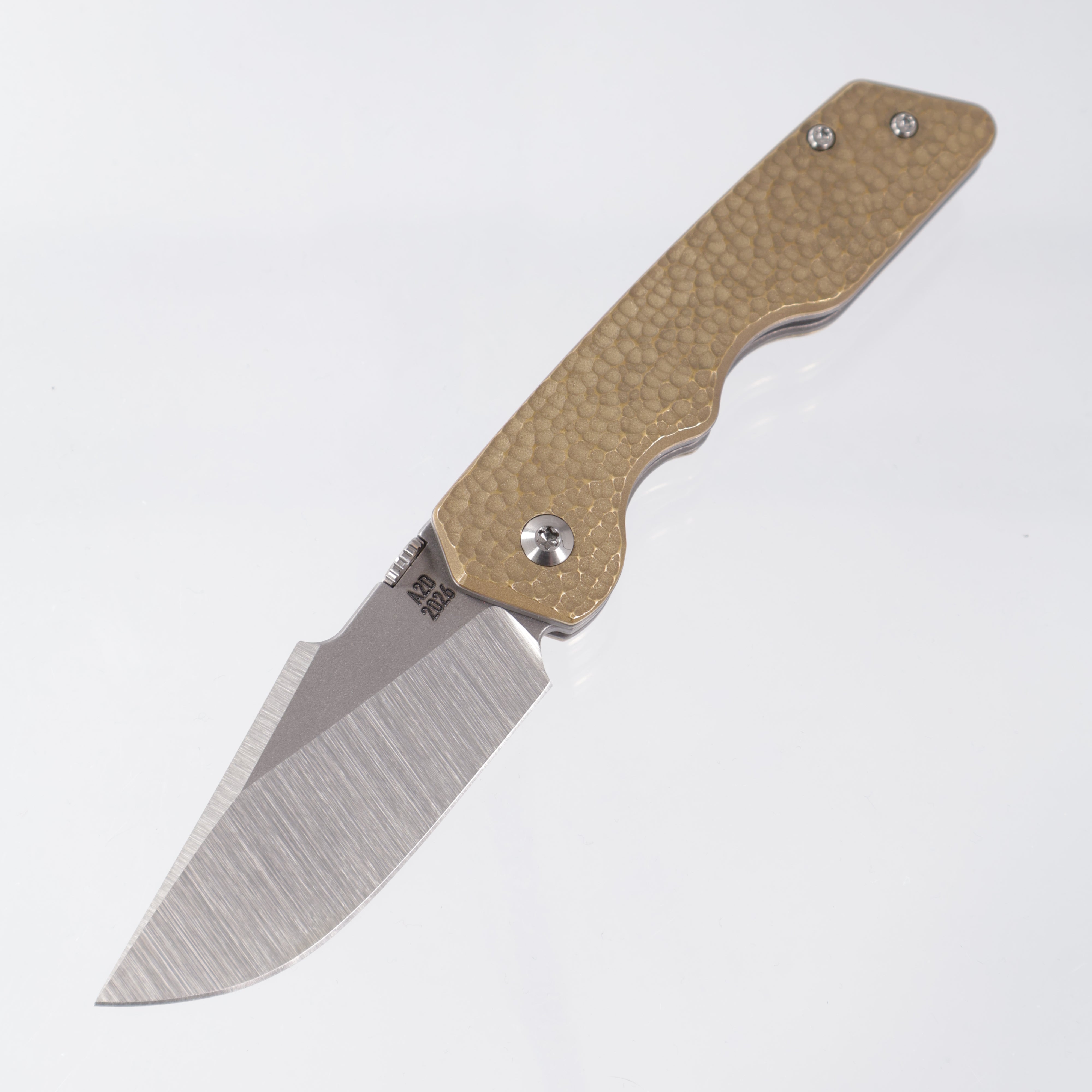 Attn2Detail Mercantile Mk.3 Medium Linerlock - Micro-Hammered Brass Scales w/ Greywash Ti Liners - Harpoon Rising Grind Magnacut