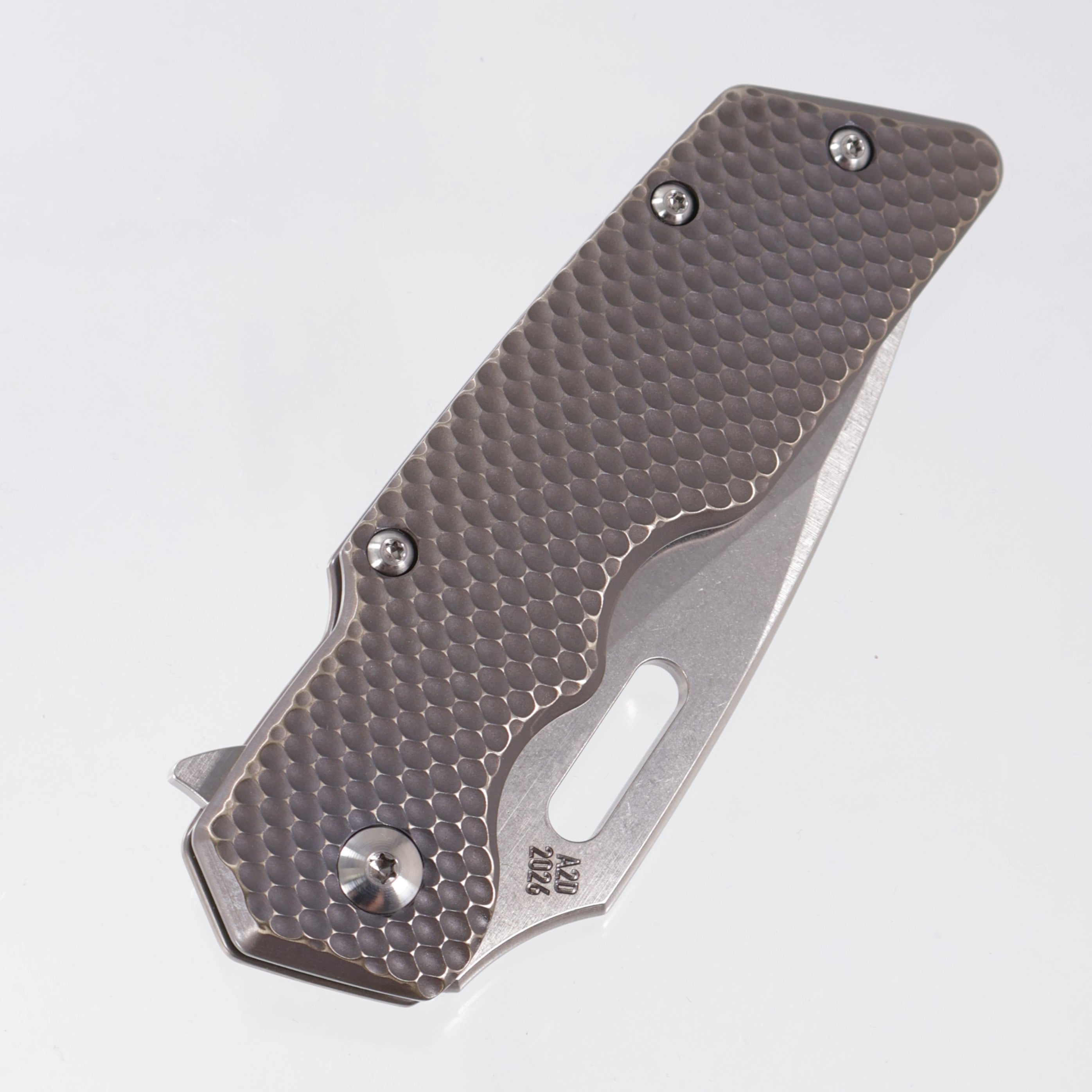 Attn2Detail Mercantile Mk.1 Large Gen4 Drop Point Rising Grind - Antique Bronze Ano Contoured Double Divot Titanium - Stonewash Satin Magnacut