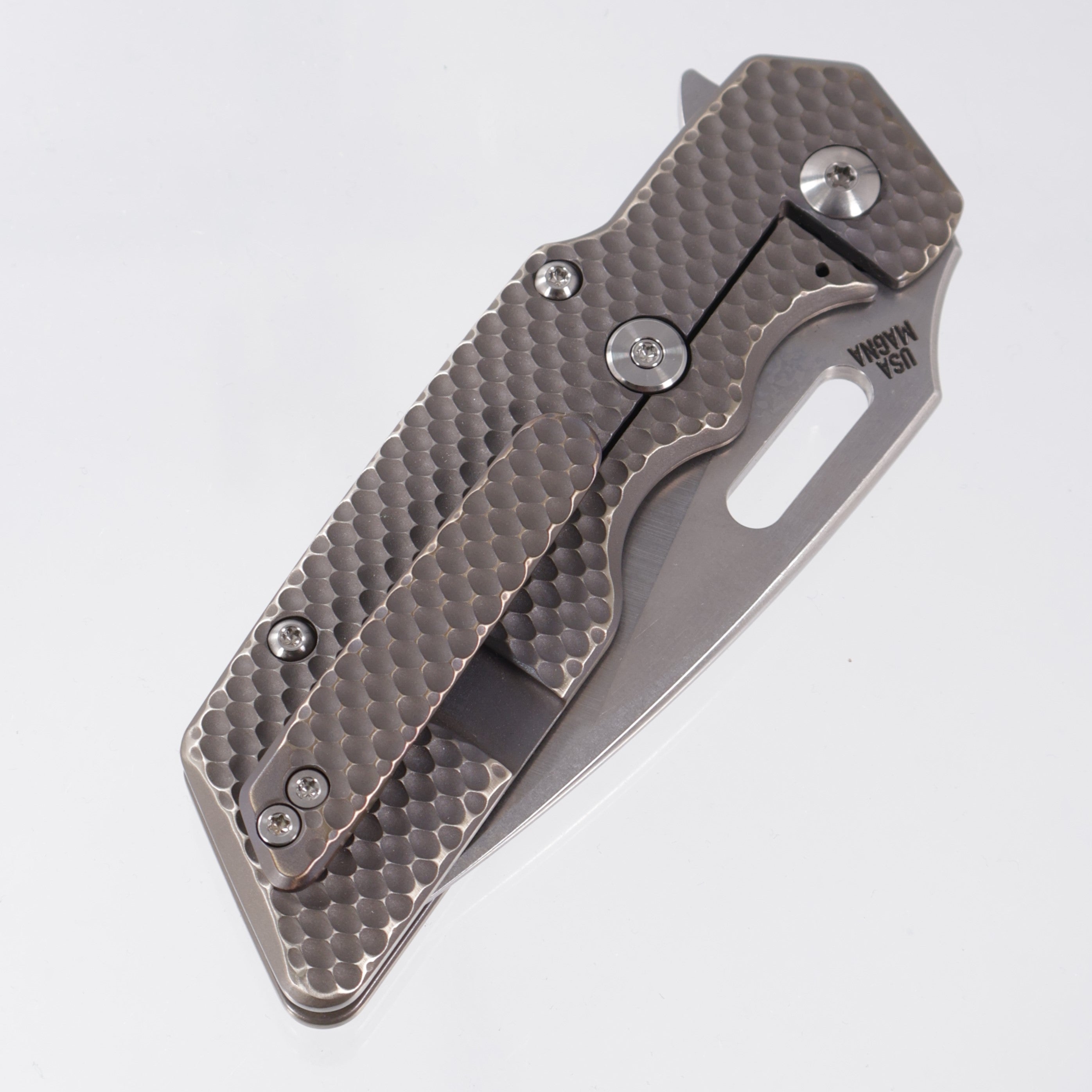 Attn2Detail Mercantile Mk.1 Large Gen4 Drop Point Rising Grind - Antique Bronze Ano Contoured Double Divot Titanium - Stonewash Satin Magnacut