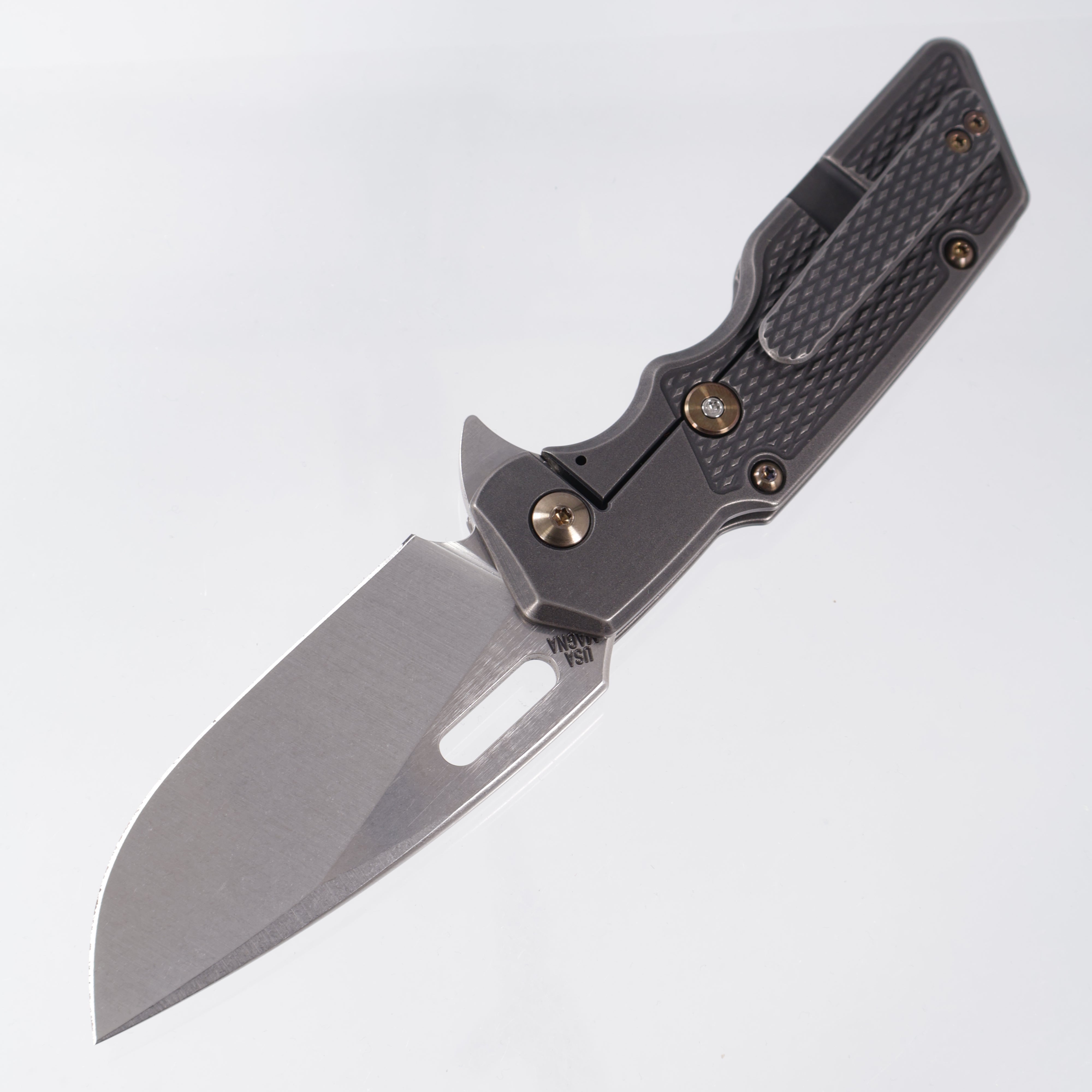 Attn2Detail Mercantile Mk.1 Large Gen4 Drop Point Rising Grind - Blackwash Contoured M16 Grip Titanium w/ Bronze Hardware - Stonewash Satin Magnacut