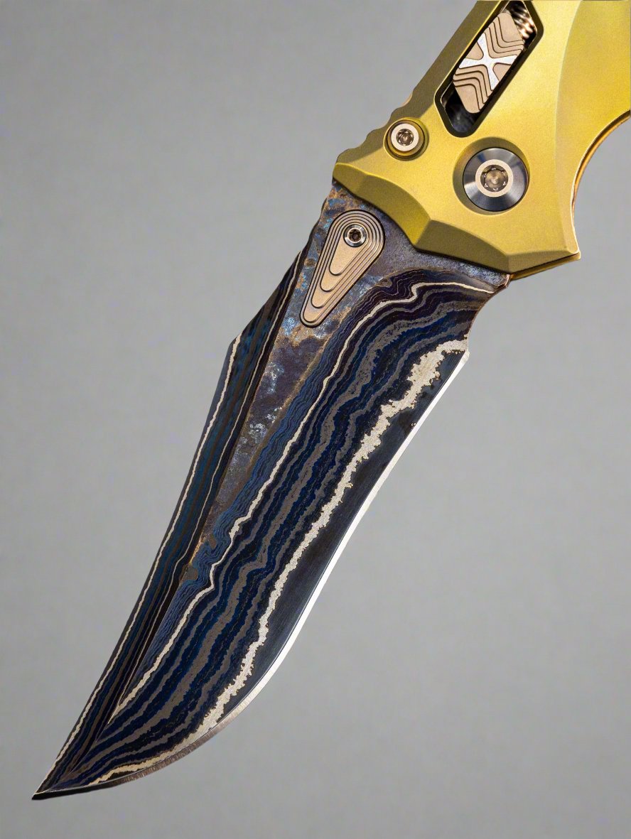 Marfione Custom Knives Amphibian RAM-LOK Metroid Sanmai w/ Nickel Shim Broken Anvil Damascus & Sovereign Gold Stippled Titanium w/ Joint Logo Dagger Engraved & Two Tone Bronzed Hardware