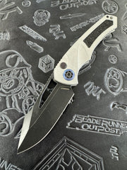 Heretic Knives Pariah Manual Button Lock Blizzard Worn Aluminum Handles Battle Black MagnaCut H046-8A-BLZ