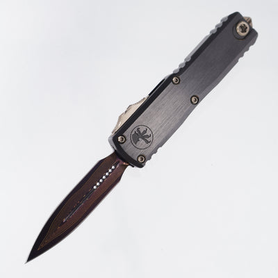 Microtech Marfione Select UTX-85 Gen III Double Edge - Hefted Black Aluminum Chassis w/ Purple Ti Accents & Bronzed Hardware - Blued Baker Forge Damascus - 1232-16MS3 *PRE-OWNED*