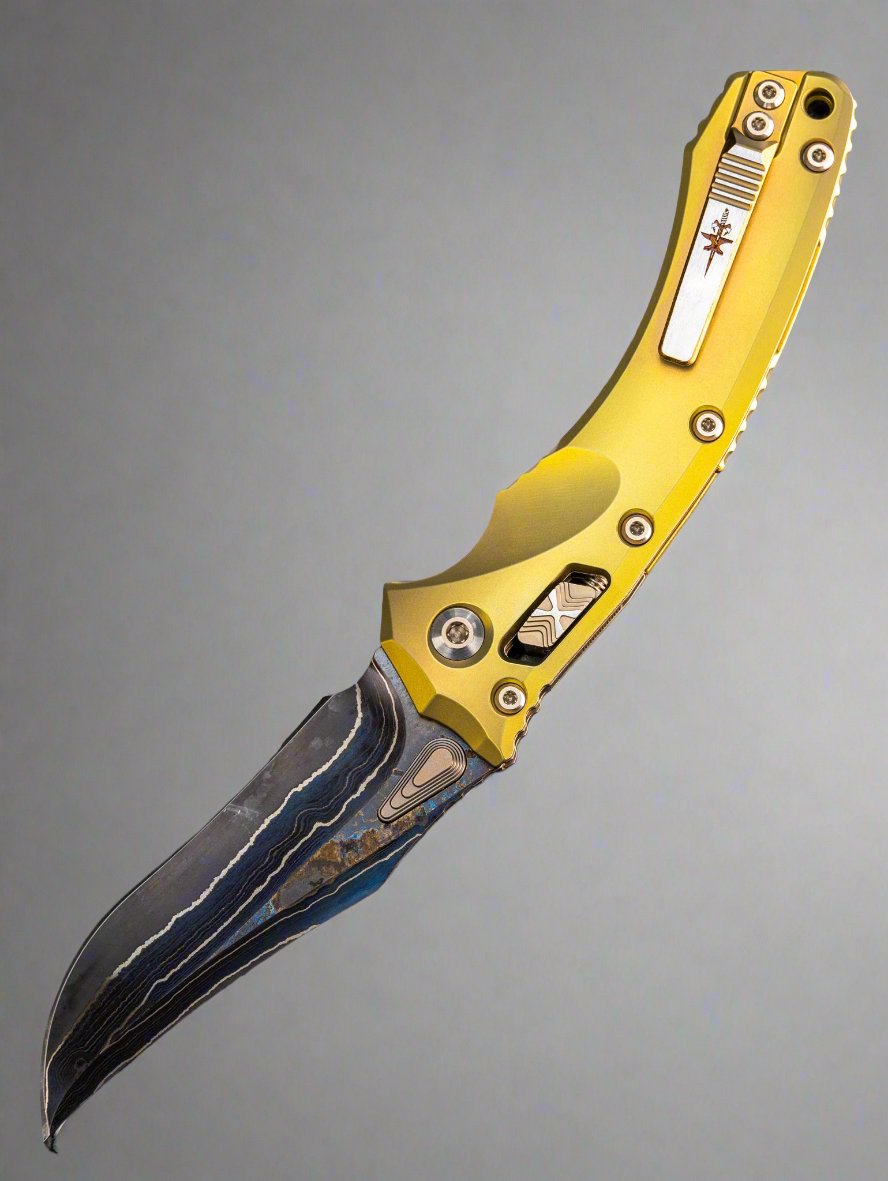 Marfione Custom Knives Amphibian RAM-LOK Metroid Sanmai w/ Nickel Shim Broken Anvil Damascus & Sovereign Gold Stippled Titanium w/ Joint Logo Dagger Engraved & Two Tone Bronzed Hardware