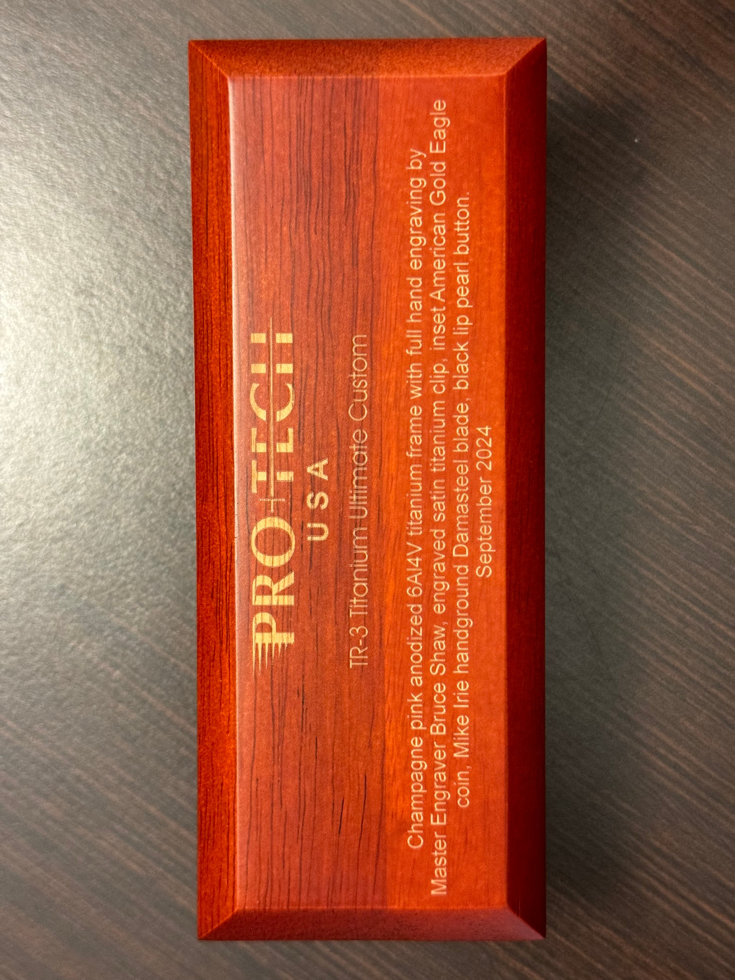 Protech Pro-Tech 2024 TR-3 Custom 002 Champagne Pink Ti Frame Bruce Shaw Hand Engraving with American Eagle Gold Coin, Irie Ground Damasteel Blade