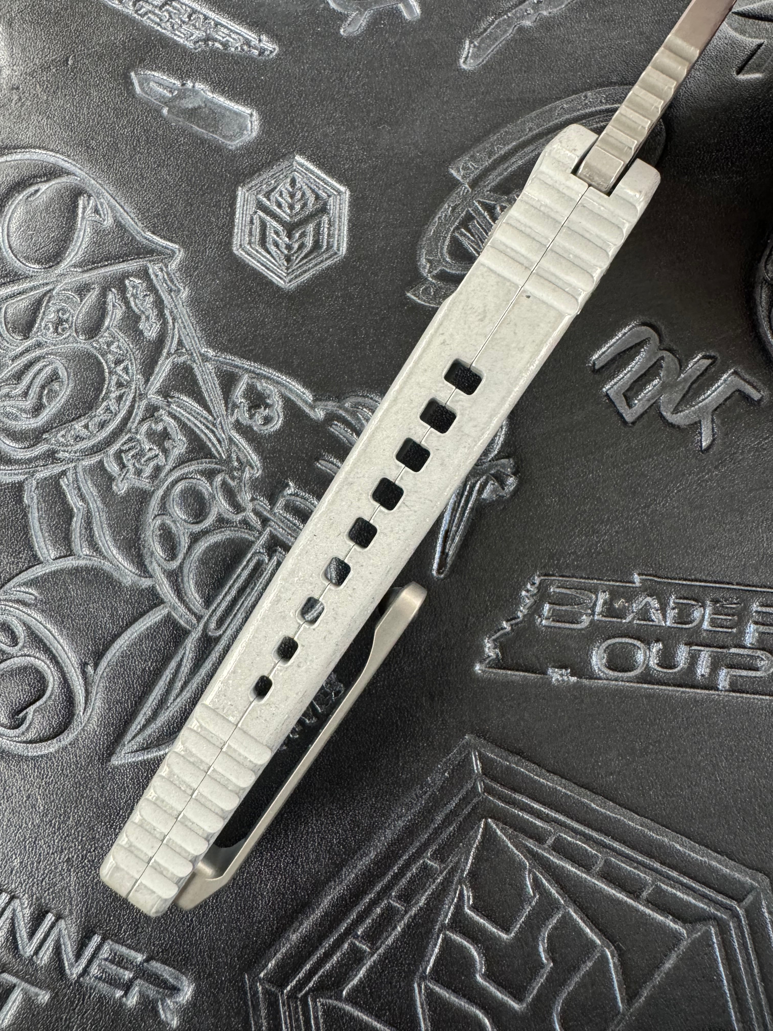 Heretic Knives Pariah Manual Button Lock Blizzard Worn Aluminum Handles w/ Stonewash MagnaCut H046-2A-BLZ
