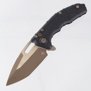 Heretic Martyr Buttonlock - Black Polymer - Bronze Battleworn Magnacut - H057-7A