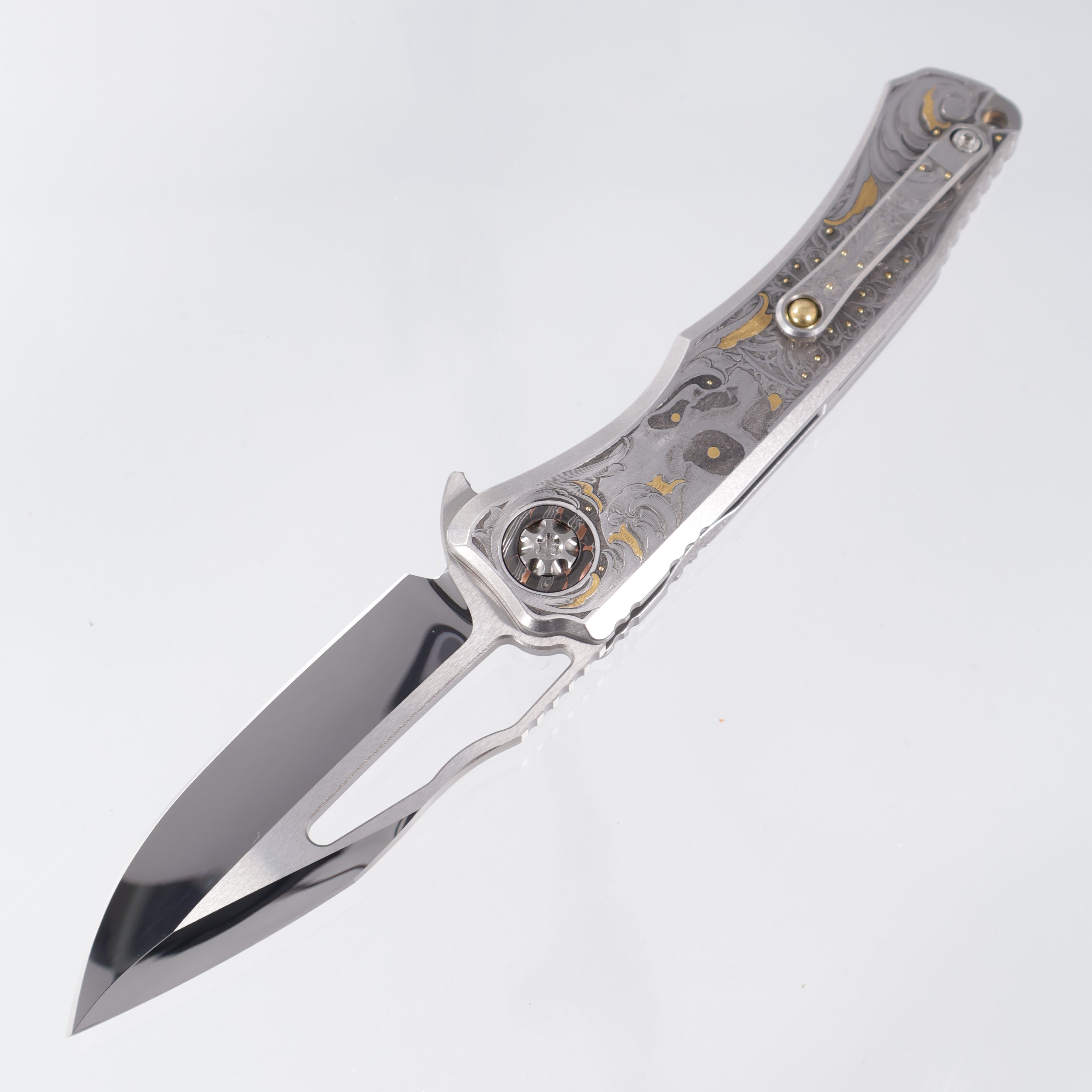 Heretic Wraith V4 Manual Custom 1 of 1 - Mirror Polish Clip Point - Hand Engraved Stainless Steel Chassis w/ Gold Embellishments by Gabriel Keeling, Damascus Pivot Collars & Mosaic Pin button inlay
