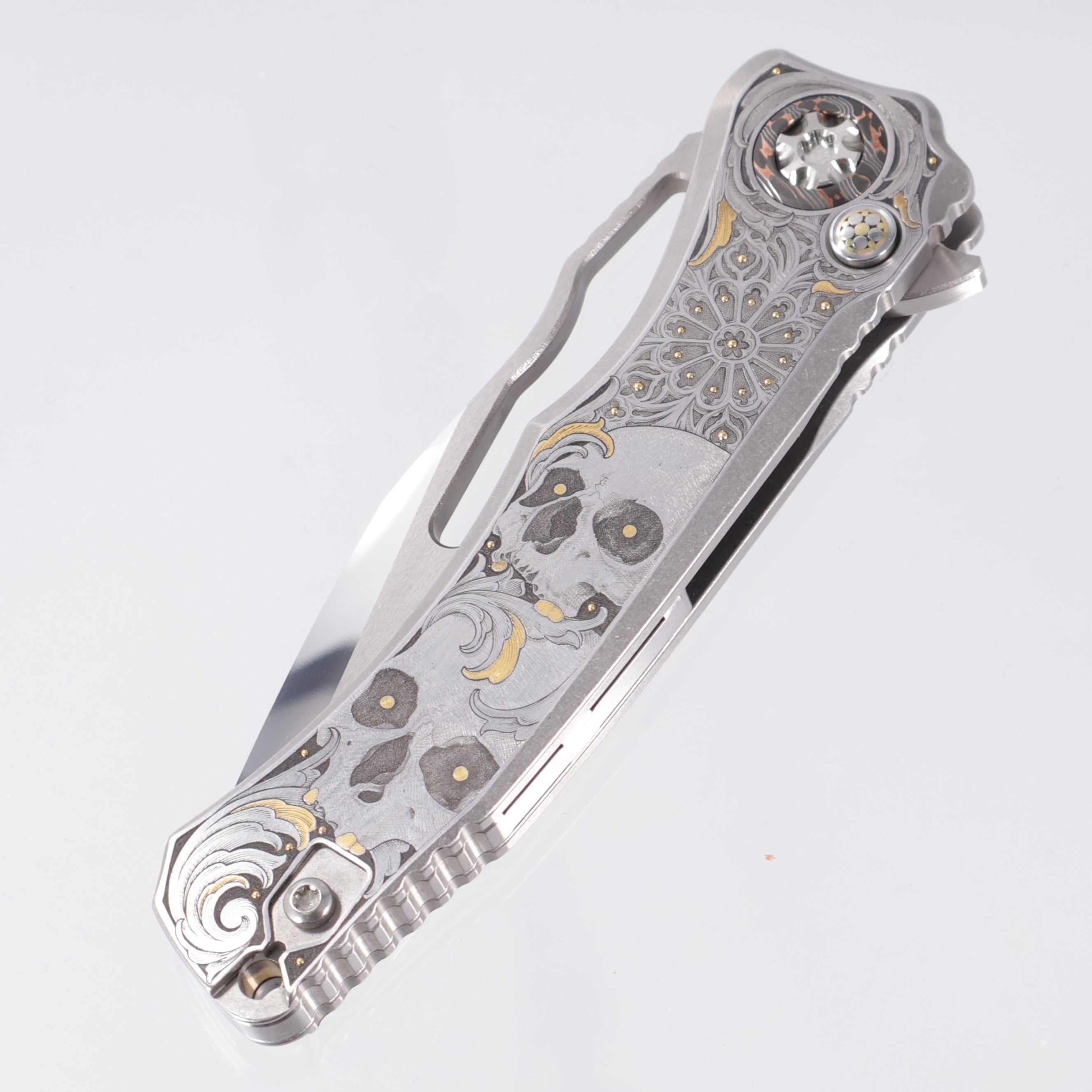 Heretic Wraith V4 Manual Custom 1 of 1 - Mirror Polish Clip Point - Hand Engraved Stainless Steel Chassis w/ Gold Embellishments by Gabriel Keeling, Damascus Pivot Collars & Mosaic Pin button inlay