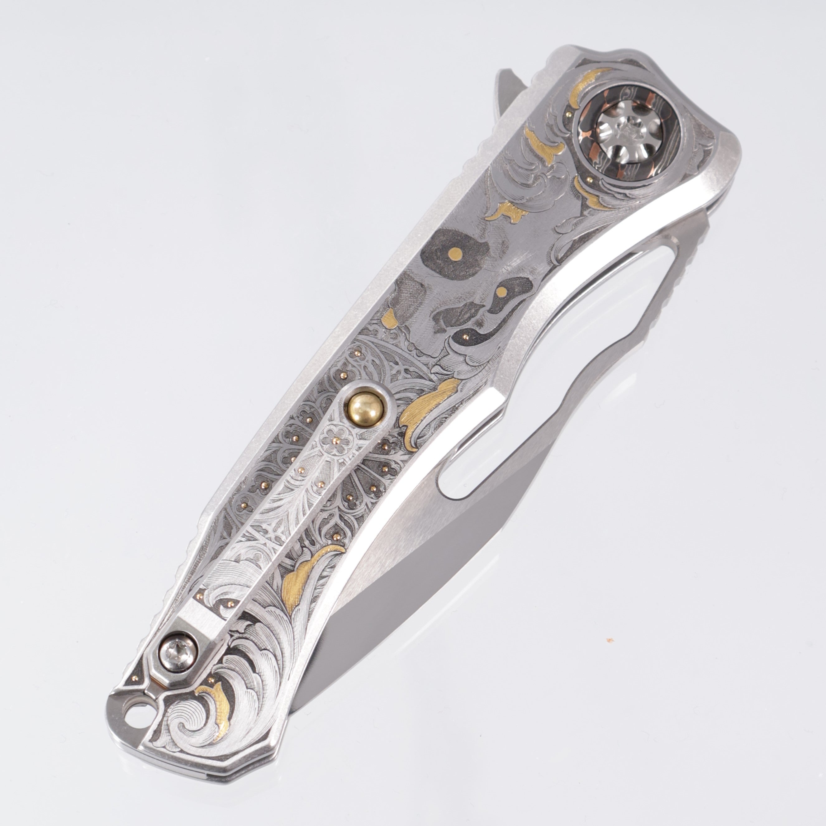 Heretic Wraith V4 Manual Custom 1 of 1 - Mirror Polish Clip Point - Hand Engraved Stainless Steel Chassis w/ Gold Embellishments by Gabriel Keeling, Damascus Pivot Collars & Mosaic Pin button inlay