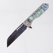 Heretic Jinn Manual Custom - Blue Vegas Forge Herringbone Damascus - Hefted Titanium Chassis w/ Abalone inlays