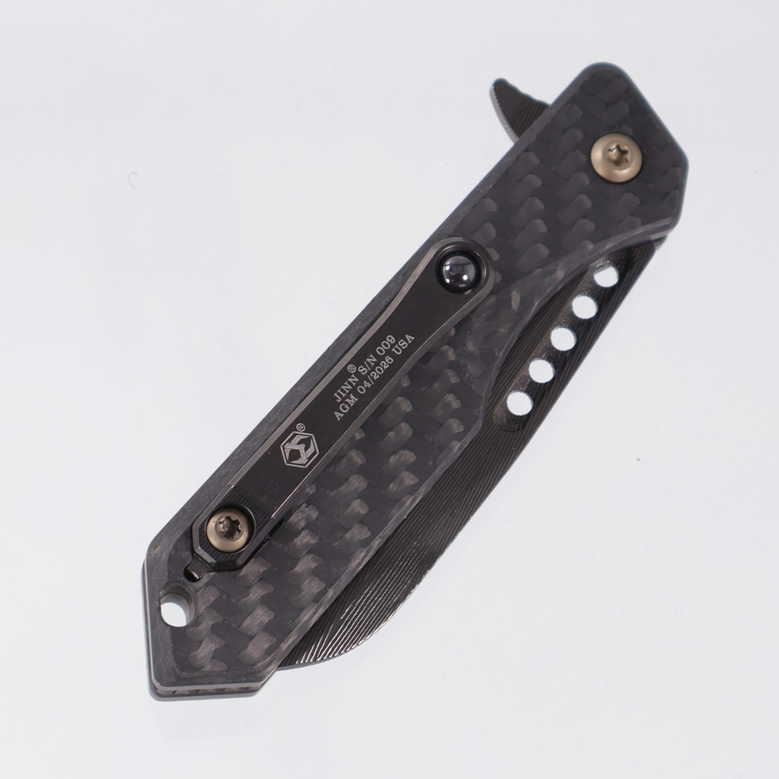 Heretic Jinn Manual Custom - Carbon Fiber Chassis w/ Bronze Ano Hardware - DLC Vegas Forge Herringbone