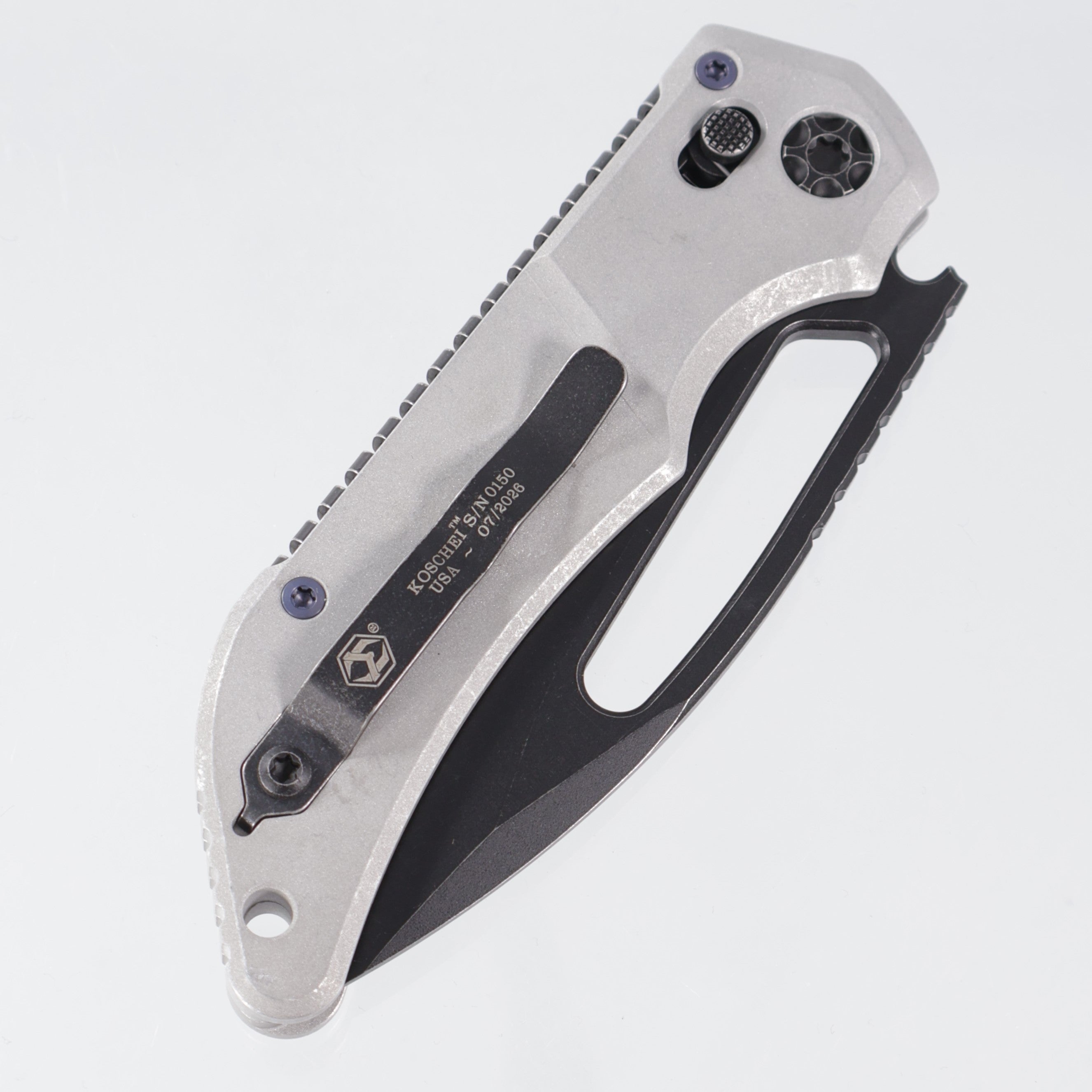 Heretic Koschei - Blizzardworn Aluminum w/ Blue Ti Hardware - Battle Black Magnacut - H061-8A-BLZ