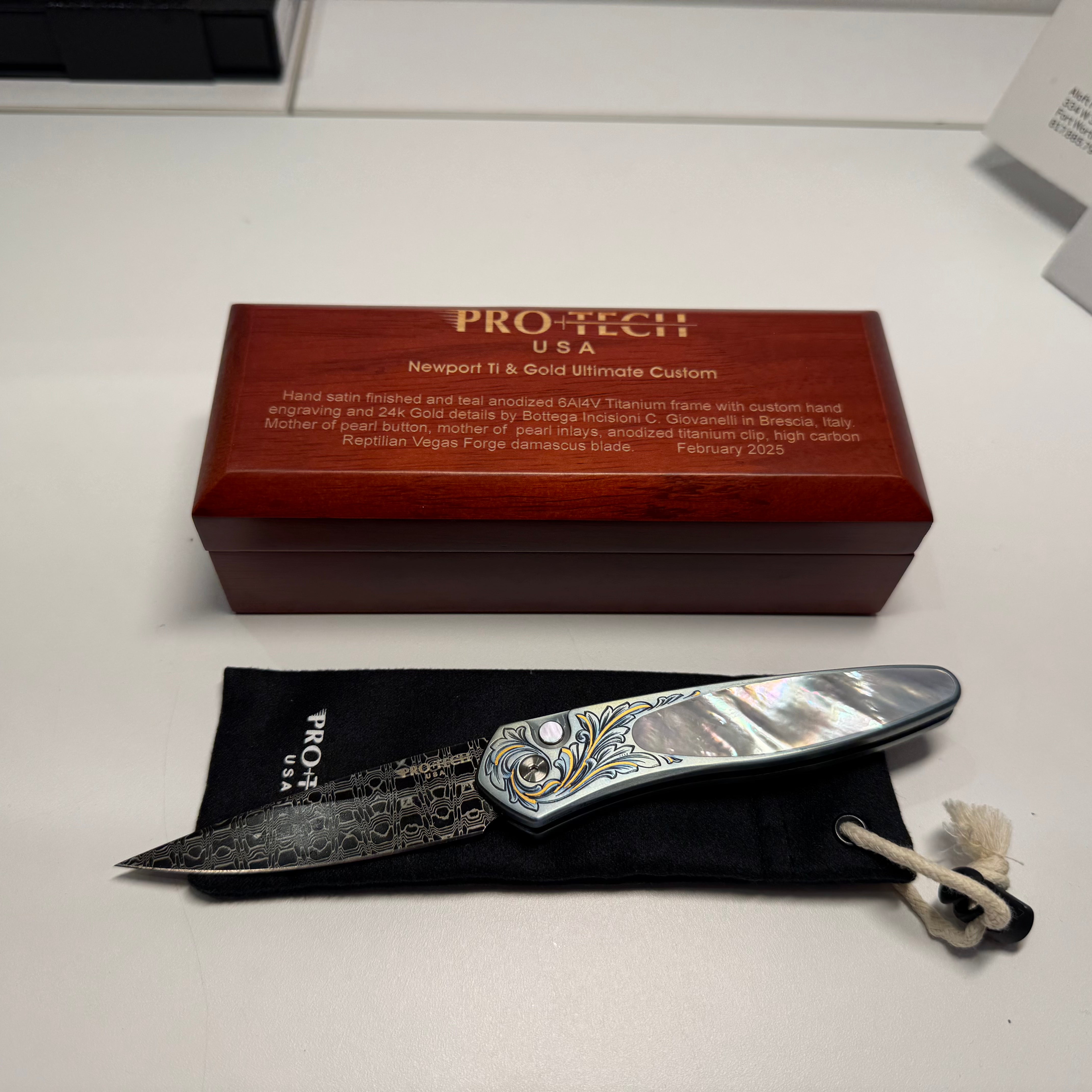 Protech Newport Ultimate Custom teal titanium, MOP button & inlay, 24k gold detailing, reptilian Damascus blade & hand engraving by Bottega Incision