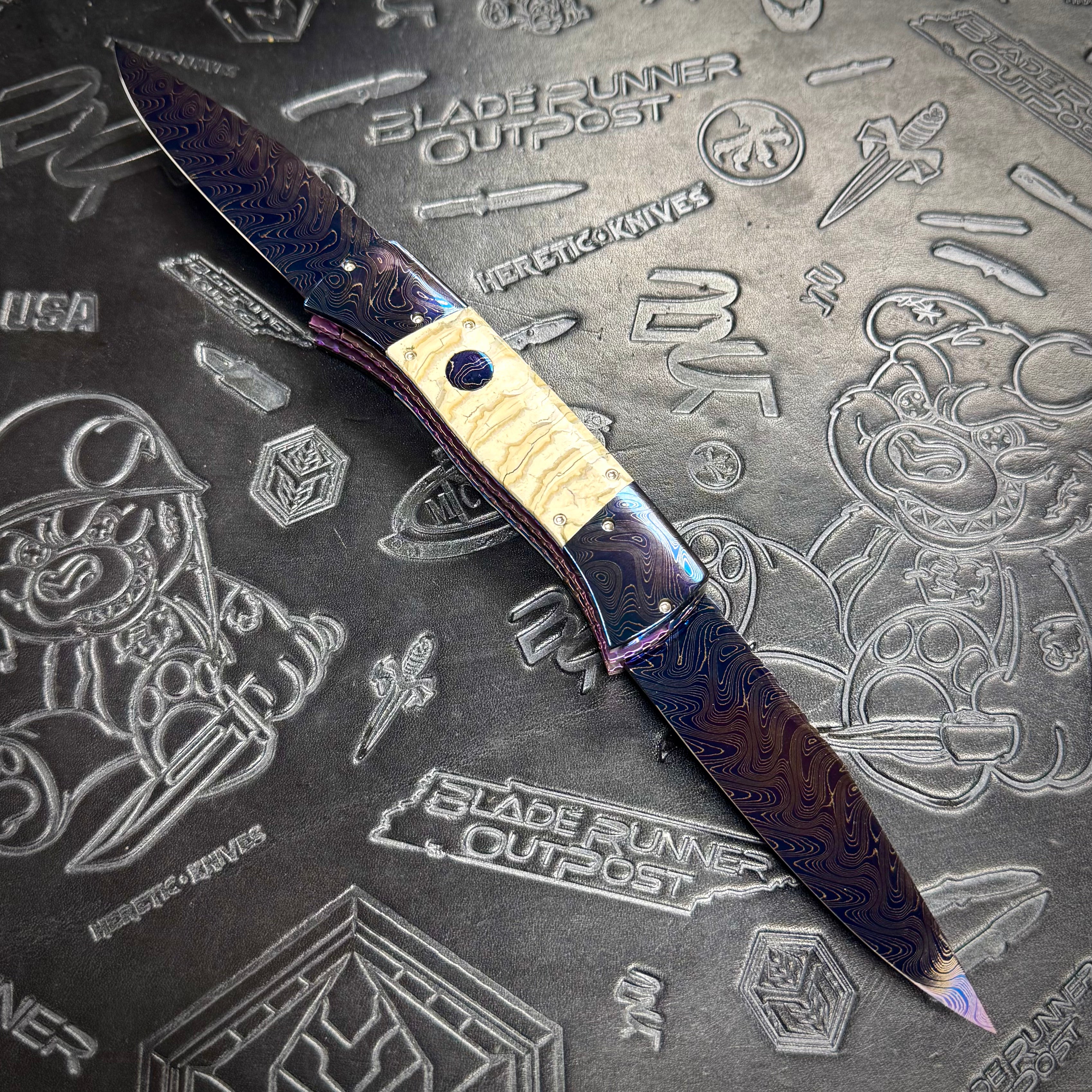 Vallotton, Rainy - T-N-T One Off custom folder - Chad Nichols’ Boomerang Damascus blade & bolsters - Mammoth Molar inlays