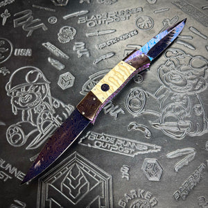 Vallotton, Rainy - T-N-T One Off custom folder - Chad Nichols’ Boomerang Damascus blade & bolsters - Mammoth Molar inlays