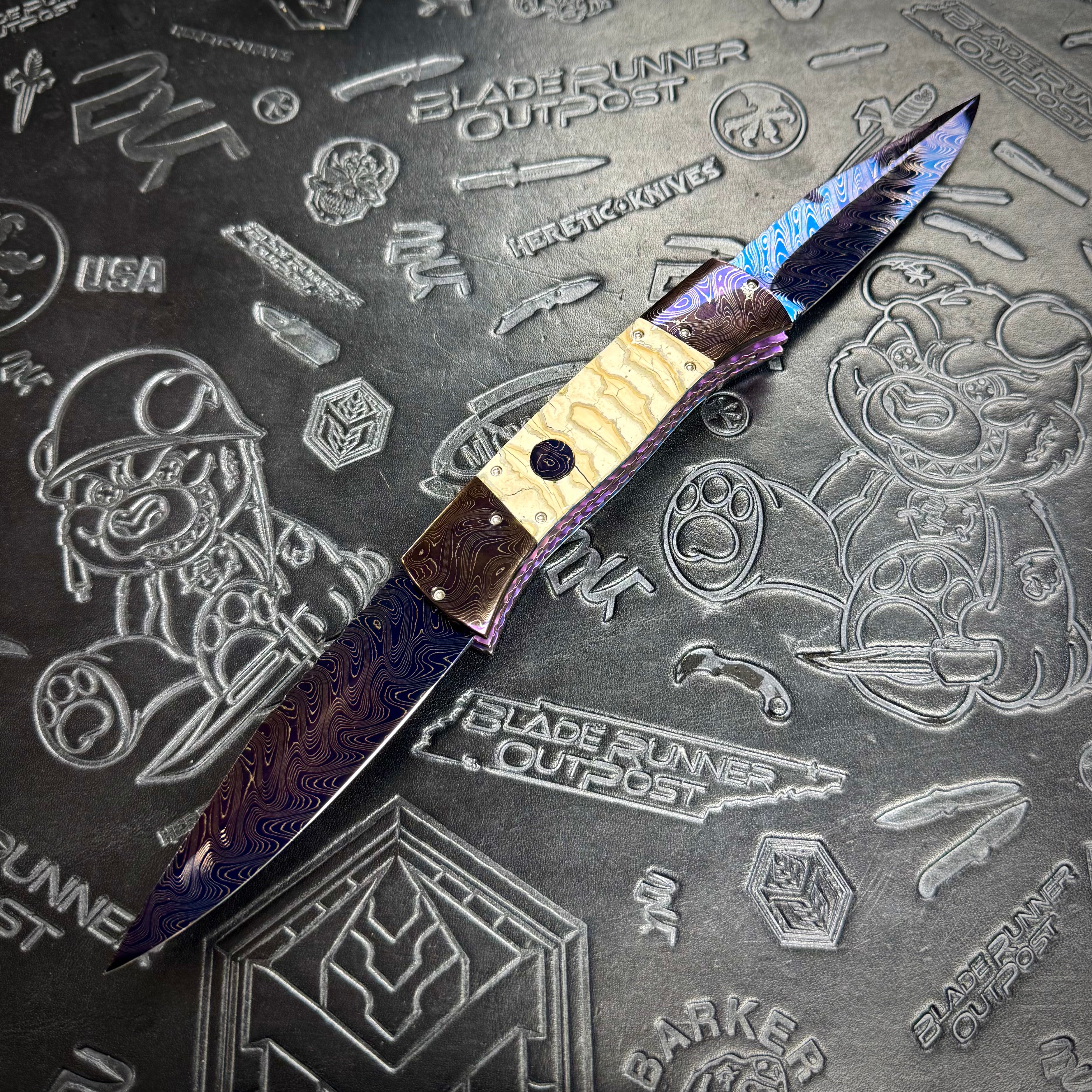 Vallotton, Rainy - T-N-T One Off custom folder - Chad Nichols’ Boomerang Damascus blade & bolsters - Mammoth Molar inlays