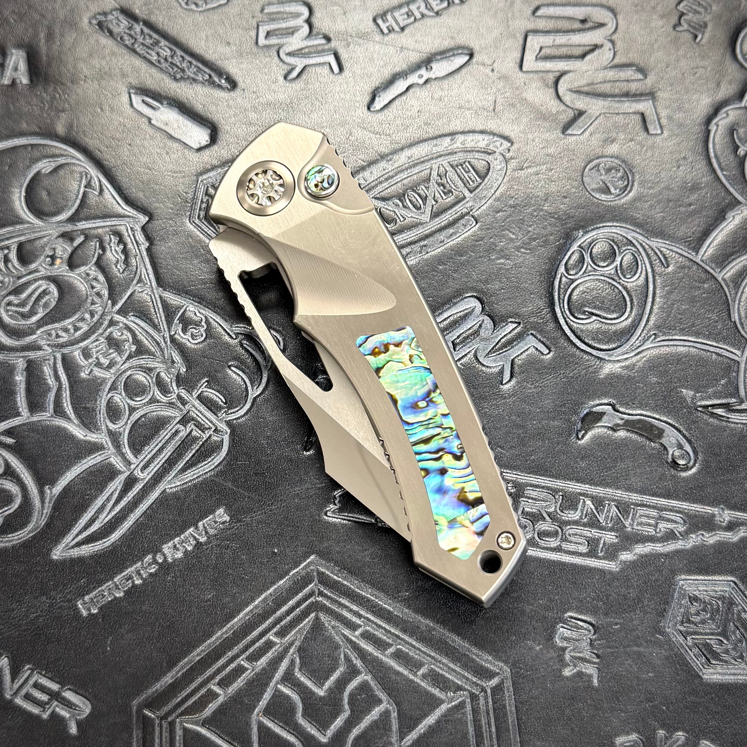 Heretic Pariah Manual Custom - Single Edge Mirror Polish - Hefted Titanium Chassis w/ Abalone inlays & Abalone button inlay S/N: 002