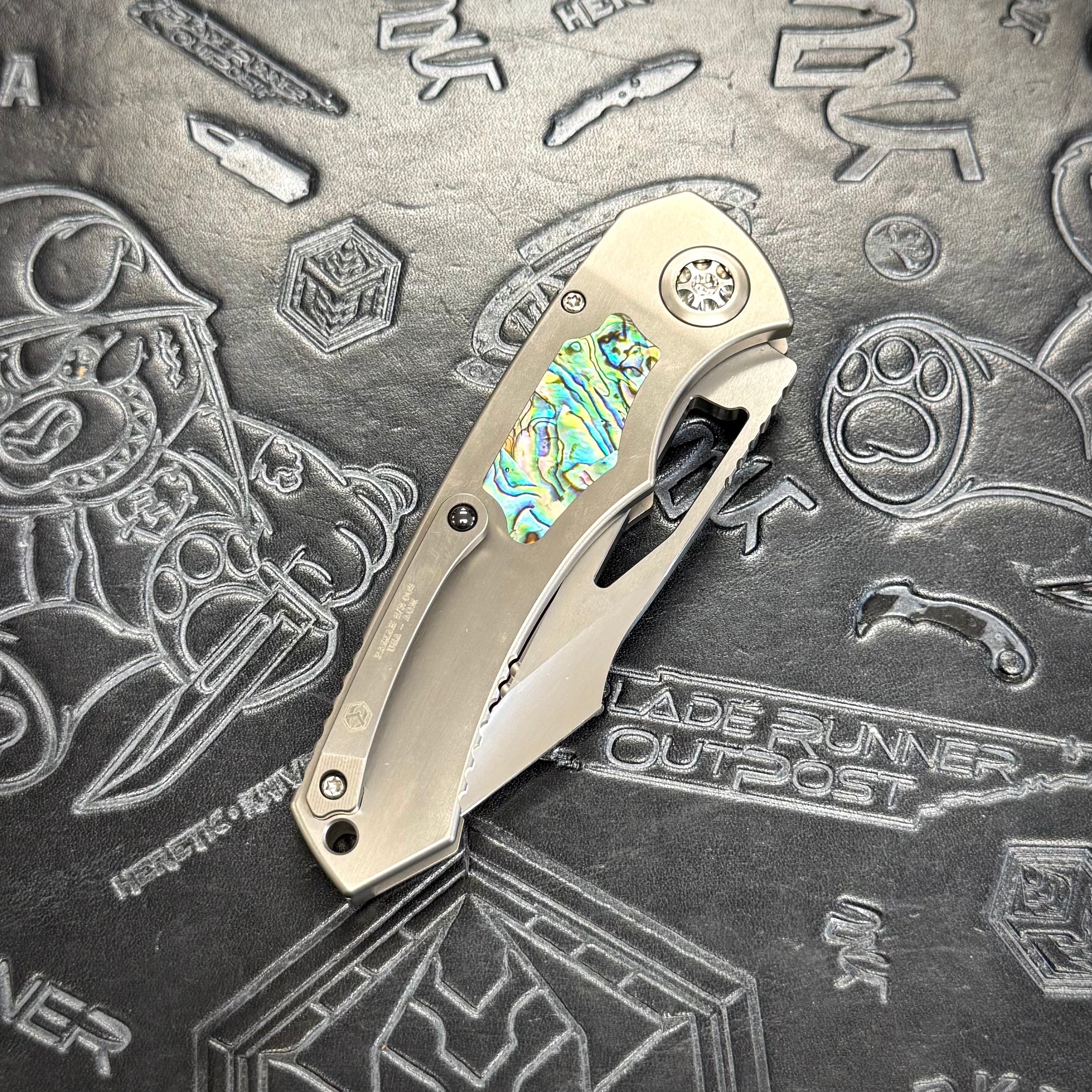 Heretic Pariah Manual Custom - Single Edge Mirror Polish - Hefted Titanium Chassis w/ Abalone inlays & Abalone button inlay S/N: 002