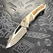 Heretic Pariah Manual Custom - Single Cracked Ice - Hefted
Titanium Chassis w/ Brown
Mammoth Inlays & Brown Mammoth button inlay S/N: 012