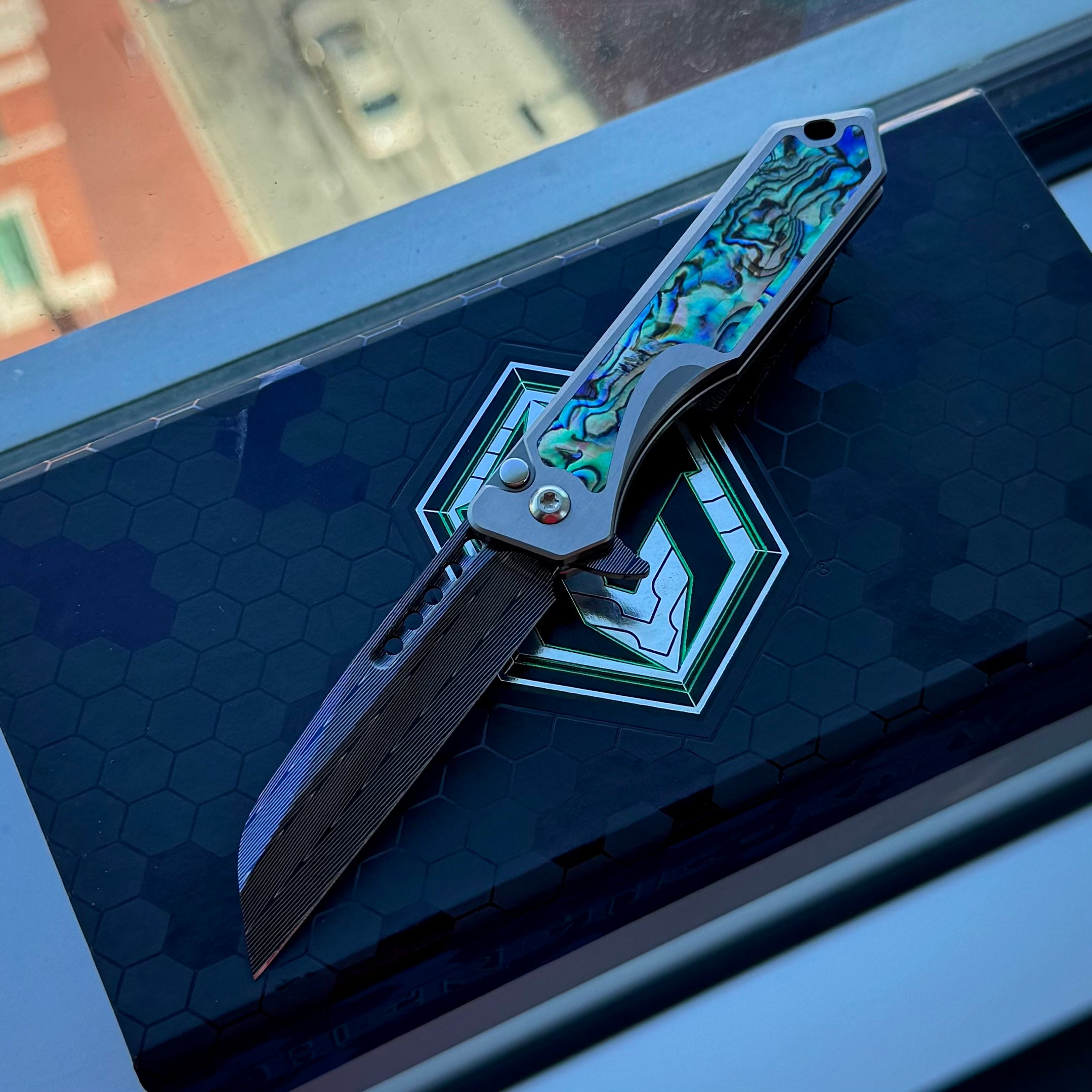 Heretic Jinn Manual Custom - Blue Vegas Forge Herringbone Damascus - Hefted Titanium Chassis w/ Abalone inlays