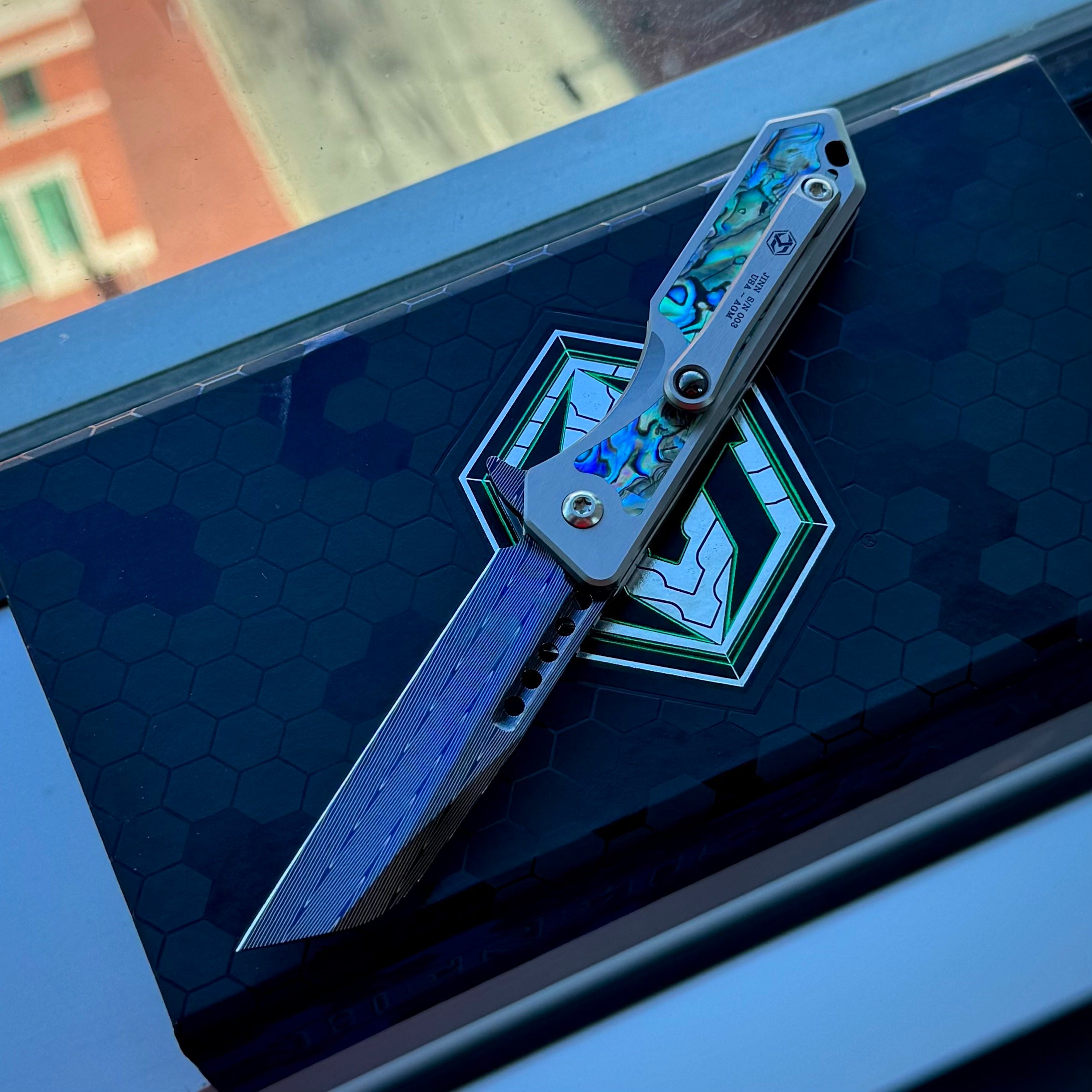 Heretic Jinn Manual Custom - Blue Vegas Forge Herringbone Damascus - Hefted Titanium Chassis w/ Abalone inlays