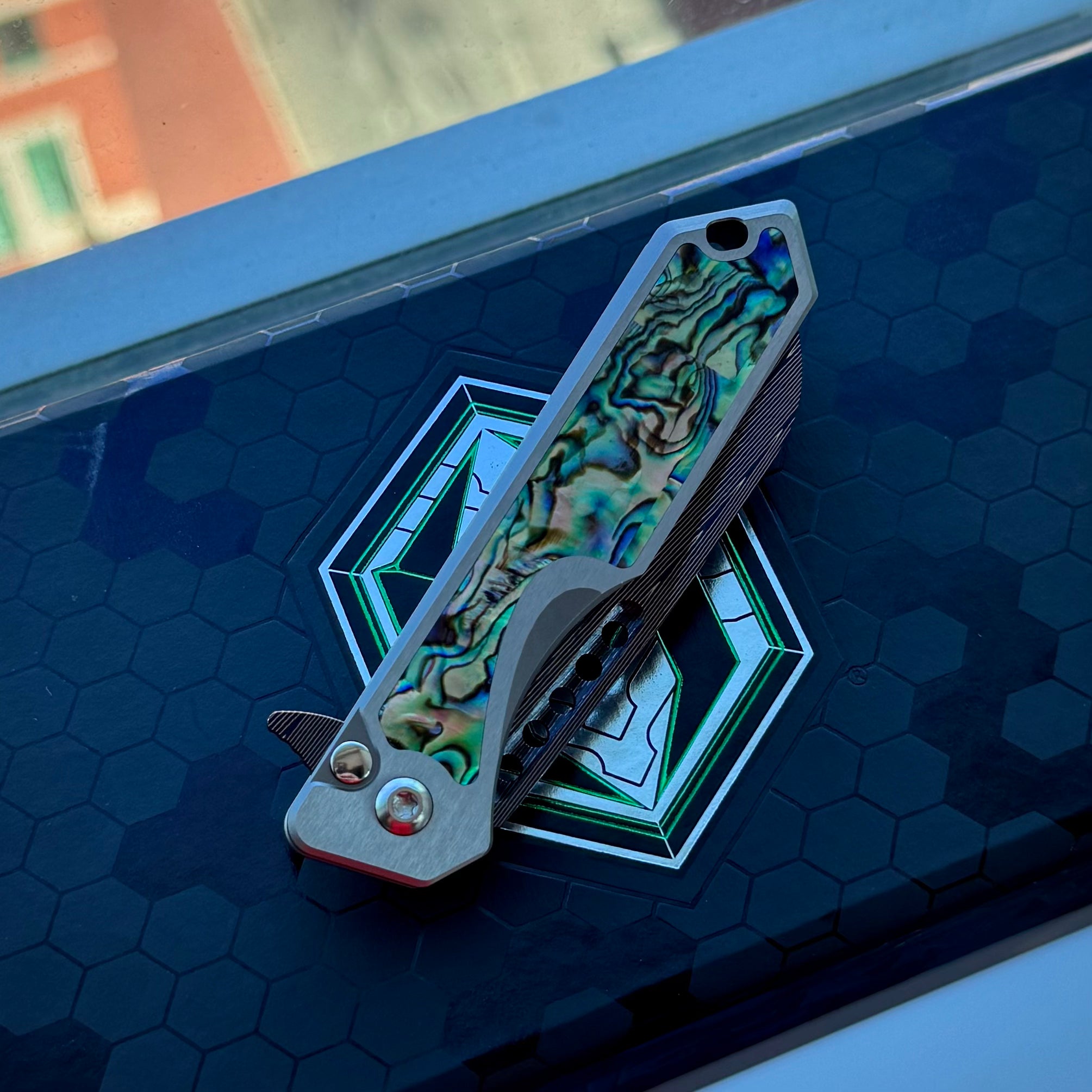 Heretic Jinn Manual Custom - Blue Vegas Forge Herringbone Damascus - Hefted Titanium Chassis w/ Abalone inlays