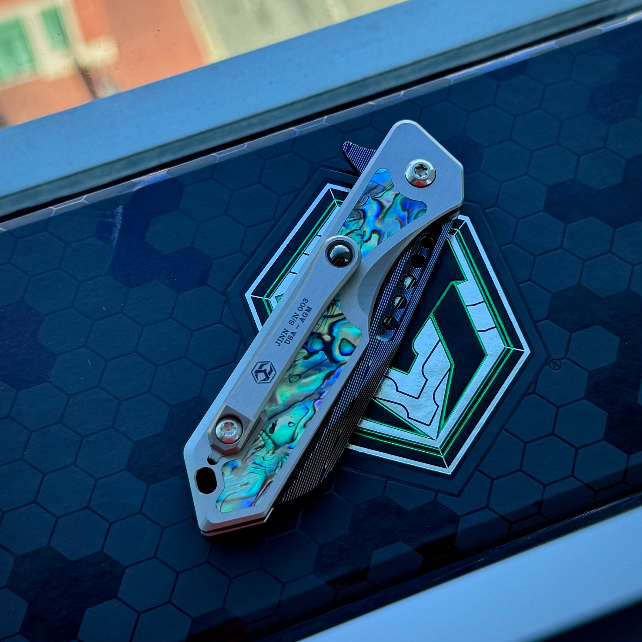 Heretic Jinn Manual Custom - Blue Vegas Forge Herringbone Damascus - Hefted Titanium Chassis w/ Abalone inlays