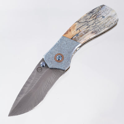 W. Guinn Knives Ebenezer Folder #5 - Ice Blue Crystalized Titanium & Mammoth w/ Copper Pivot Collars - Bulldog Thunder Chicken Damascus