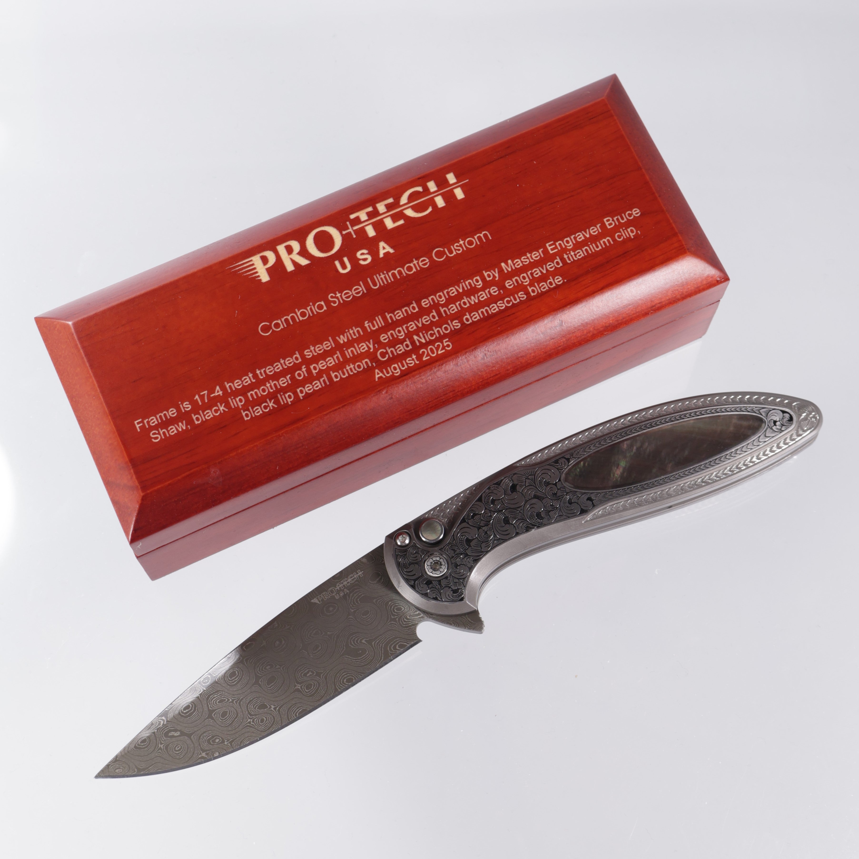 Protech Cambria 2 2025 Ultimate Custom 012 - Bruce Shaw fully engraved 17-4 steel handle w/ Black Lip Pearl inlay & button - Chad Nichols Damascus (Option #2)