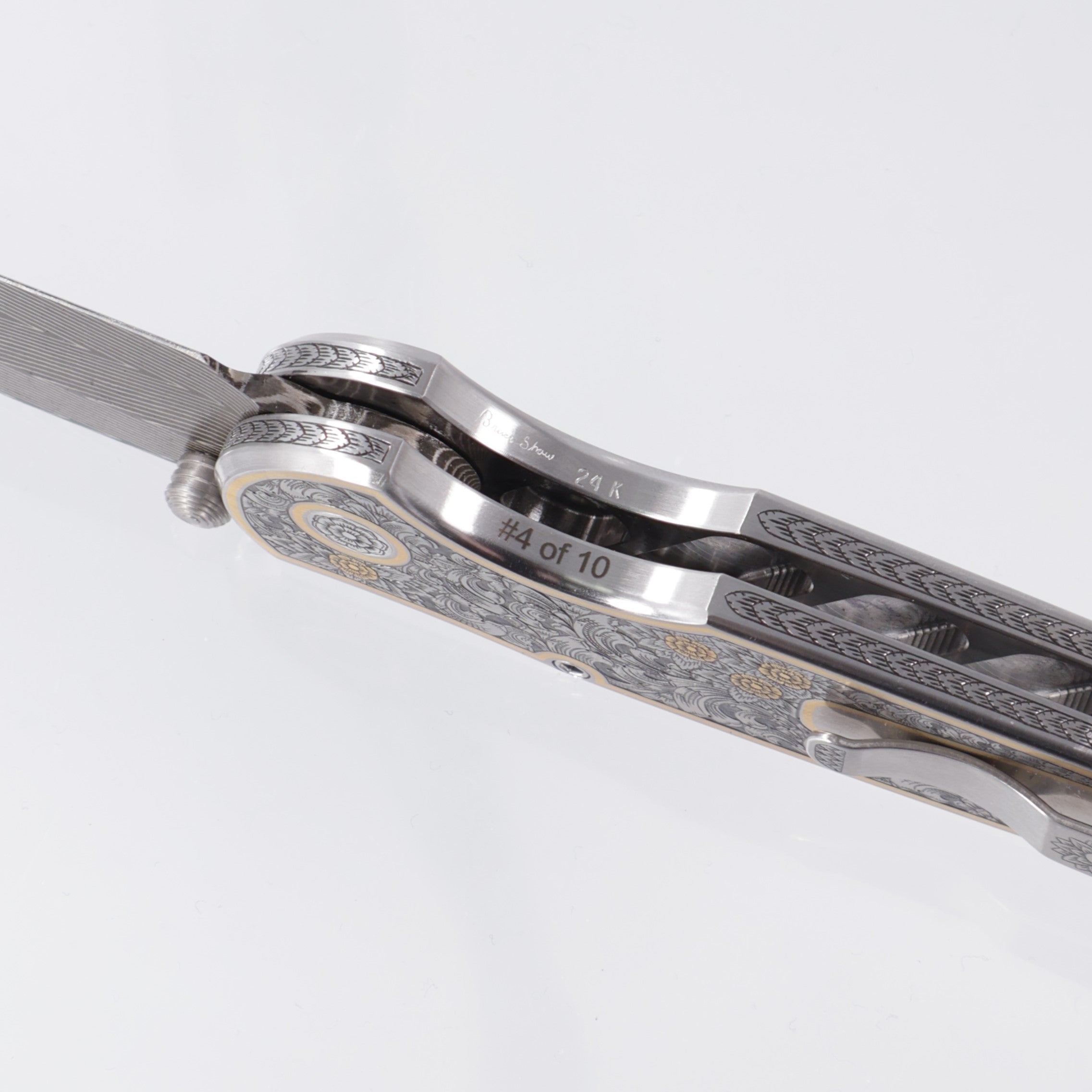 Pro-Tech TR-3 Integrity Gold & Steel Ultimate Custom #4 - Hand Engraved Deluxe Leafy Scroll Stainless chassis by Bruce Shaw w/ 24kt Gold Hand Sculpted Eagle inlay - Happy Jewelers Custom Mosaic Diamond button - Vegas Forge Carbon Herringbone Damascus