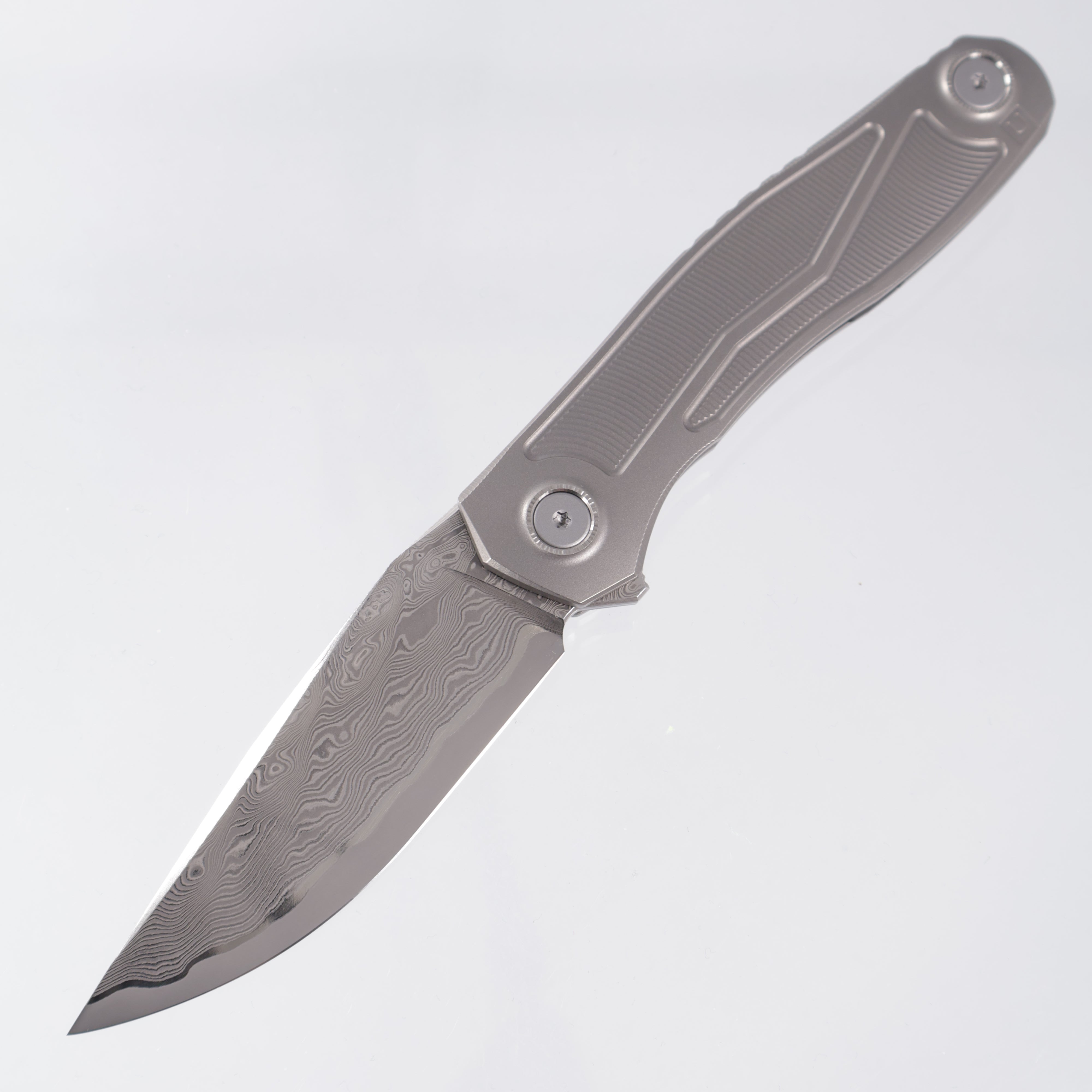 Uldanov Knives R2 Semi-Integral - Radial Milled Titanium w/ Integrated Backstrap - Laminated Magnacut Core Damascus