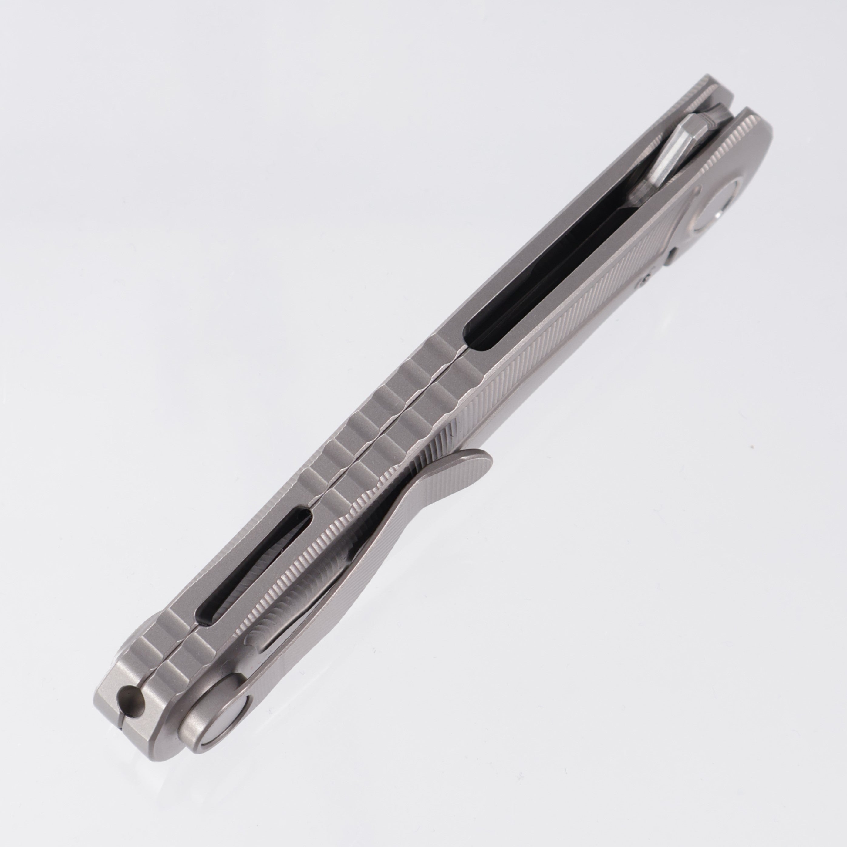 Uldanov Knives R2 Semi-Integral - Radial Milled Titanium w/ Integrated Backstrap - Laminated Magnacut Core Damascus
