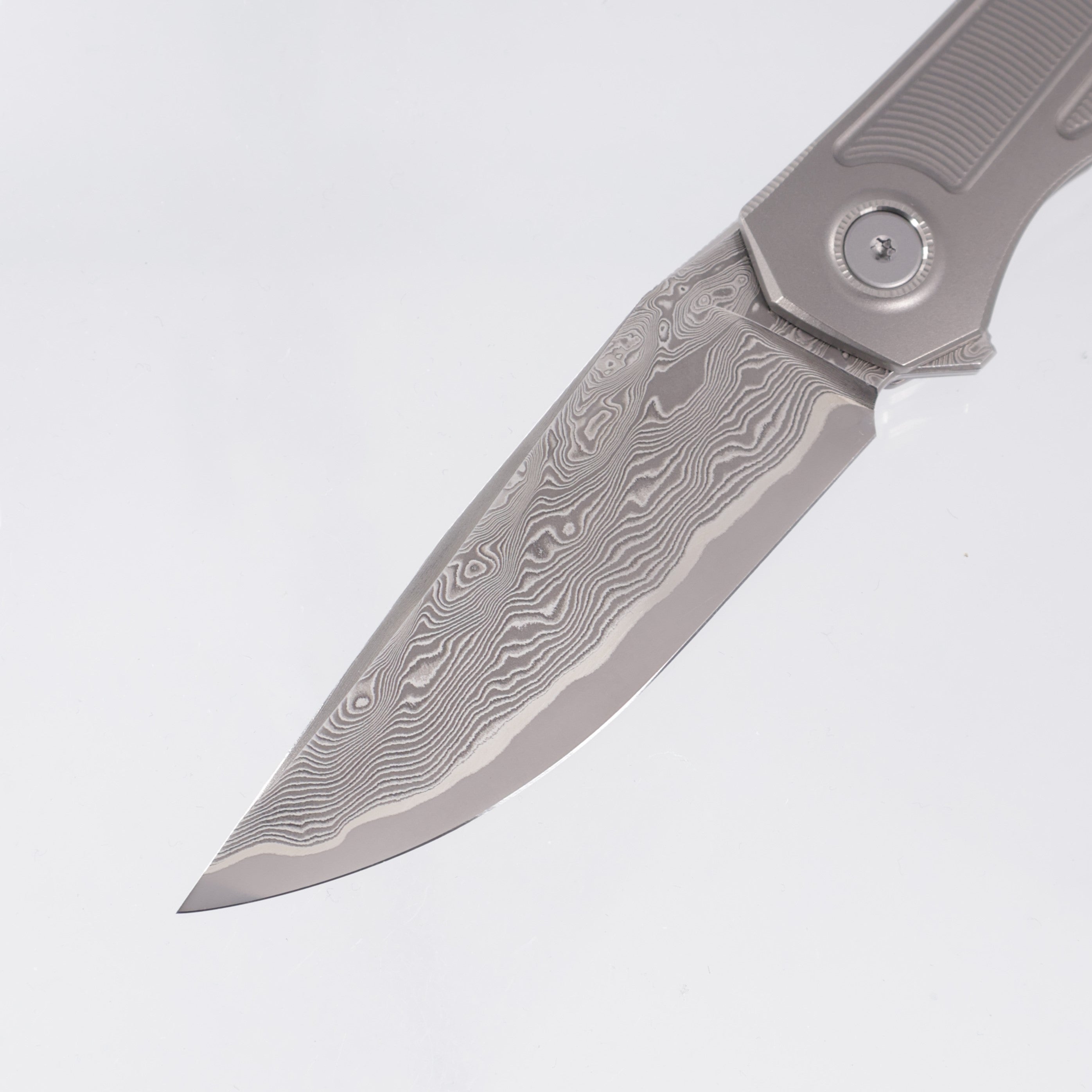 Uldanov Knives R2 Semi-Integral - Radial Milled Titanium w/ Integrated Backstrap - Laminated Magnacut Core Damascus